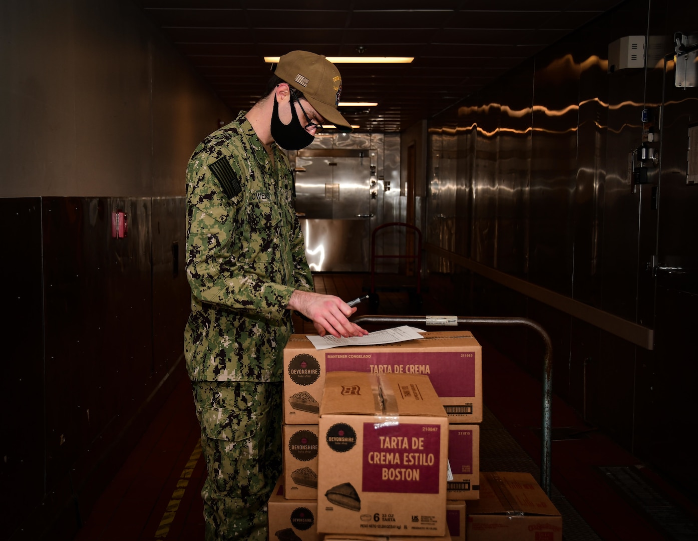 Culinary Specialist 2nd Class Jacob Owens, Naval Medical Center Portsmouth’s (NMCP) cargo leading petty officer, takes inventory of desserts in the fridge of the galley, Dec. 1.