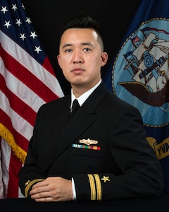 Official portrait of Lt. Cuong T. Le, assistant officer-in-charge, U.S. Navy Information Operation Detachment, Korea.