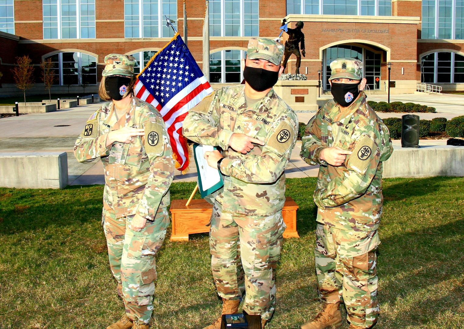 Col. Melissa Hoffman, Sgt. Pete Nguyen and Command Sgt. Maj. Hector Santiago-Perez