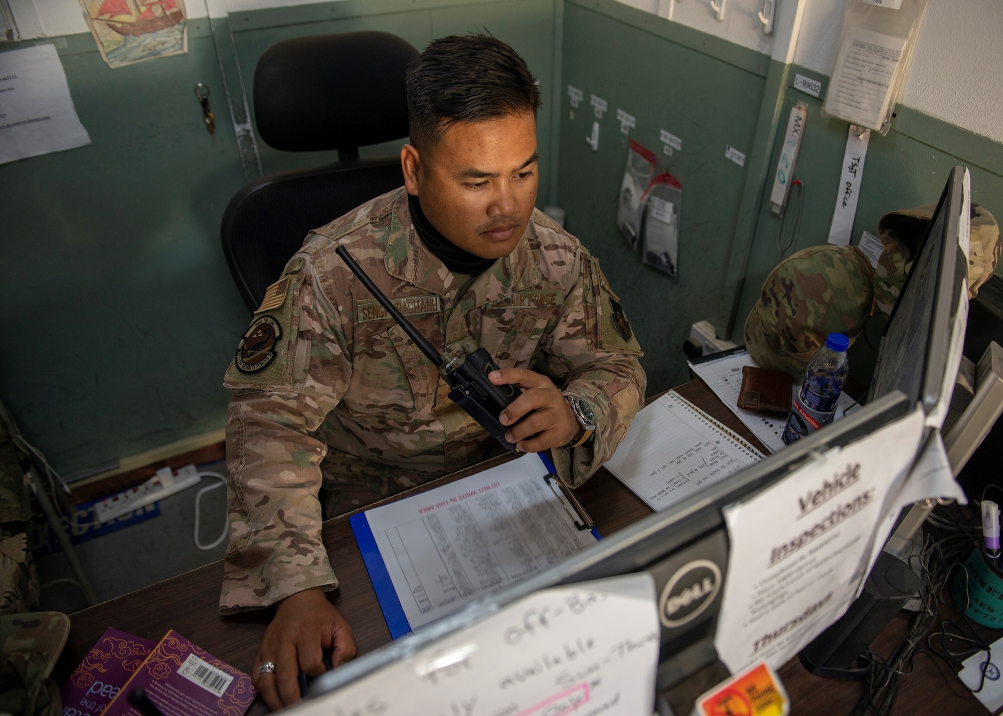 U.S. Air Force Senior Airmen Phaysawan Sengphrachanh, 380th Expeditionary Security Forces Squadron Force Protection Hawkeye flight escort, uses a radio to contact personnel at Al Dhafra Air Base, United Arab Emirates, Nov. 22, 2020.