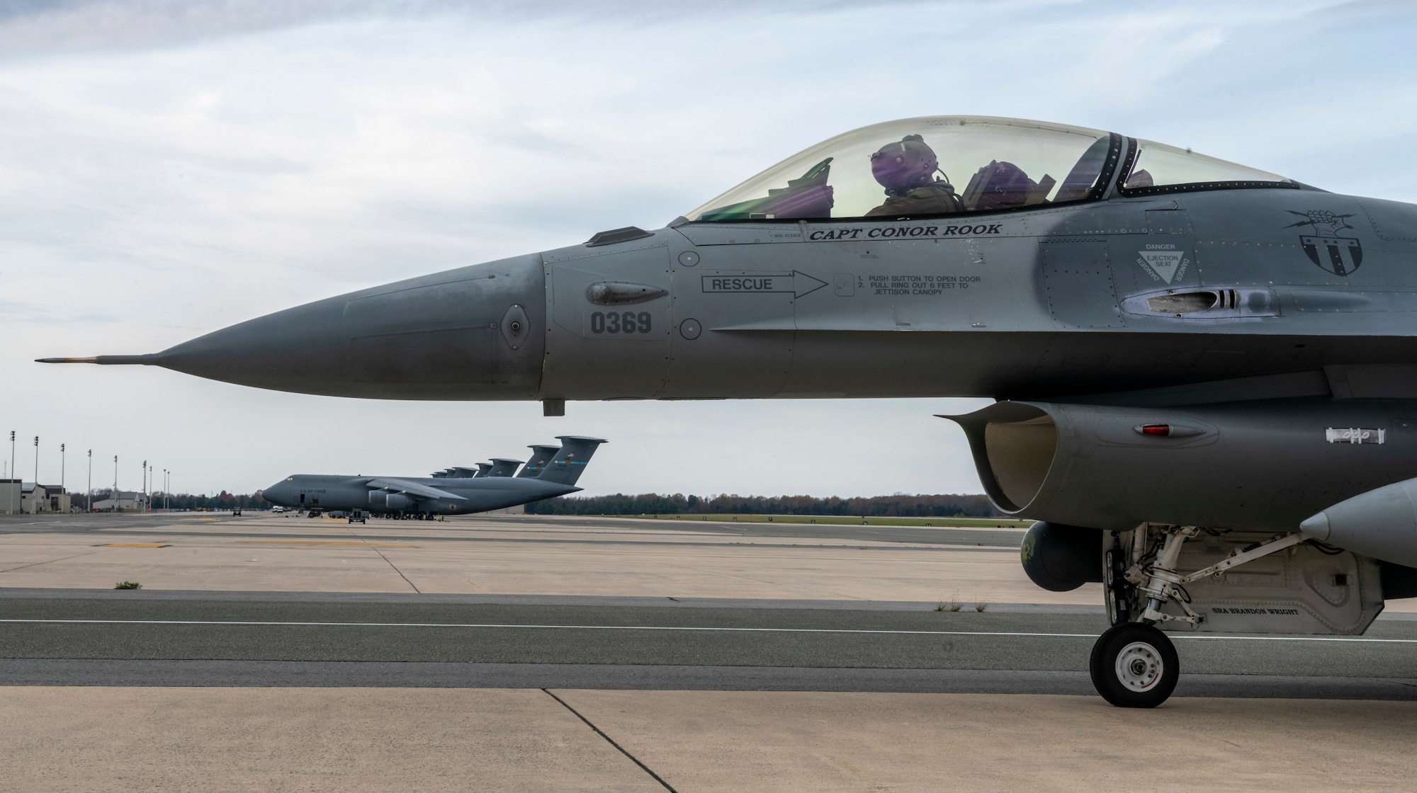 An F-16 Fighting Falcon, assigned to the 121st Fighter Squadron at Joint Base Andrews, Maryland, prepares for takeoff at Dover Air Force Base, Delaware, Nov. 25, 2020. The aircraft stopped at Dover Air Force Base during routine flight training operations. The base prioritizes providing unrivaled installation support for mission partners, transit aircraft and neighboring installations. (U.S. Air Force photo by Senior Airman Christopher Quail)