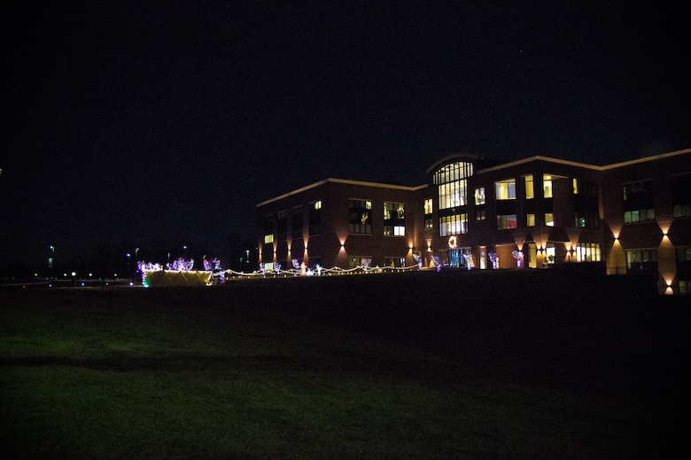 ERDC Headquarters building with lit lights.