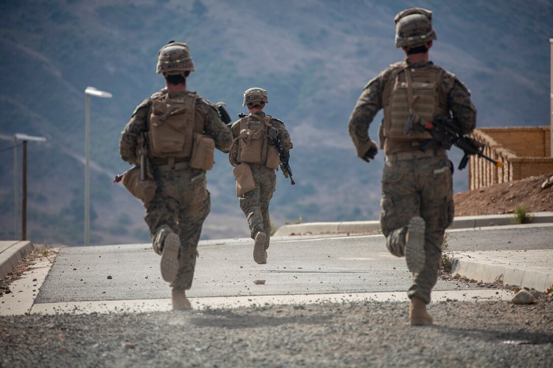 201105-M-UY835-1039 MARINE CORPS BASE CAMP PENDLETON, Calif. (Nov. 5, 2020) – U.S. Marines with Charlie Company, Battalion Landing Team 1/4, 15th Marine Expeditionary Unit, run to a casualty evacuation point during an aerial raid training operation. The Makin Island Amphibious Ready Group and the 15th MEU are currently conducting at-sea training events in the U.S. 3rd Fleet area of operations. (U.S. Marine Corps photo by Cpl. Patrick Crosley)