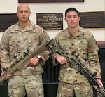 New York Army National Guard's Sgt 1st Class Matthew Melendez ( left) and Sgt. Andreas Diaz, both members of the 1st Battalion, 69th Infantry, pose for a photograph in the unit's historic Lexington Avenue Armory in New York City on Nov. 25, 2020.