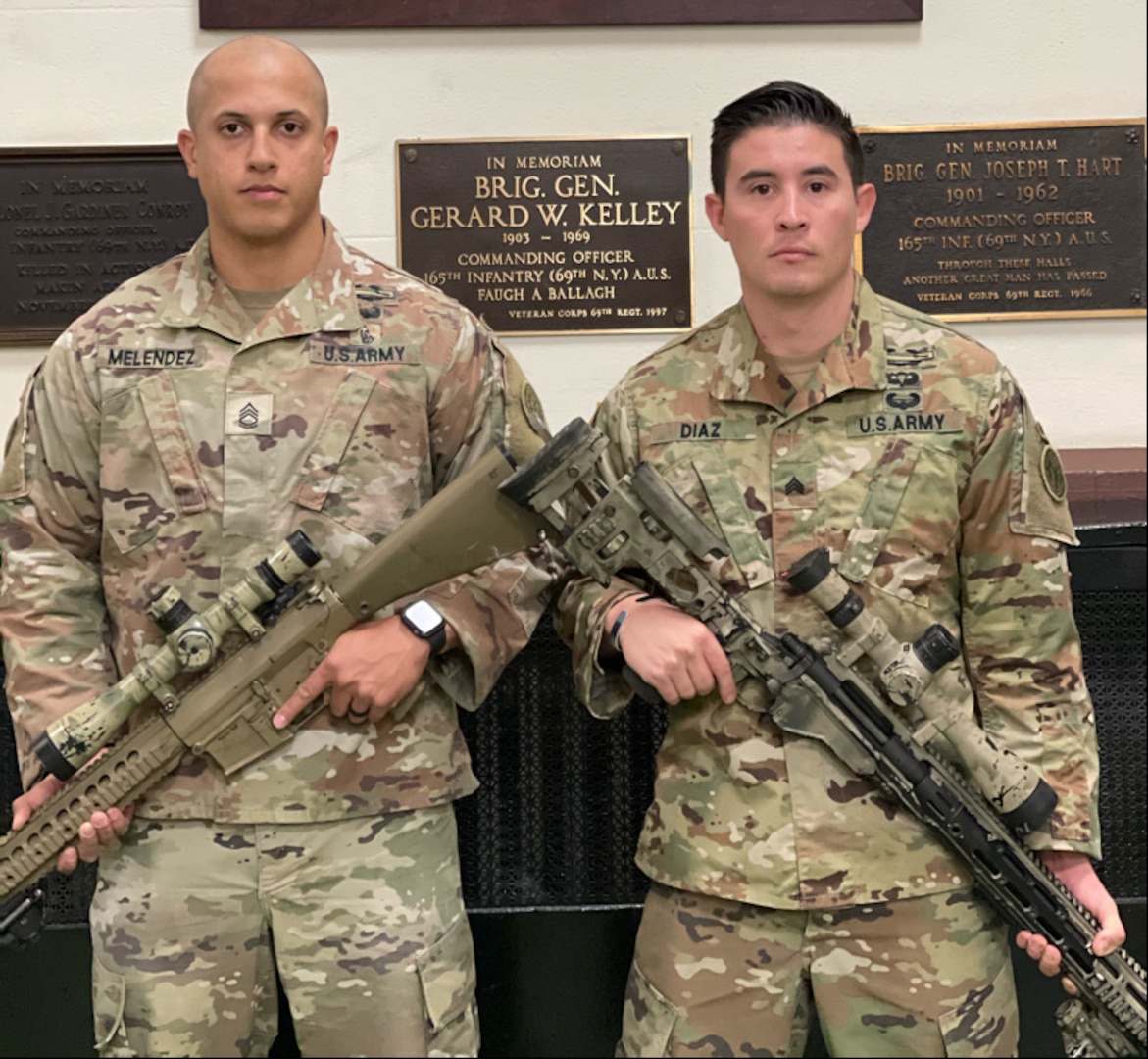 New York Army National Guard's Sgt 1st Class Matthew Melendez ( left) and Sgt. Andreas Diaz, both members of the 1st Battalion, 69th Infantry, pose for a photograph in the unit's historic Lexington Avenue Armory in New York City on Nov. 25, 2020.
