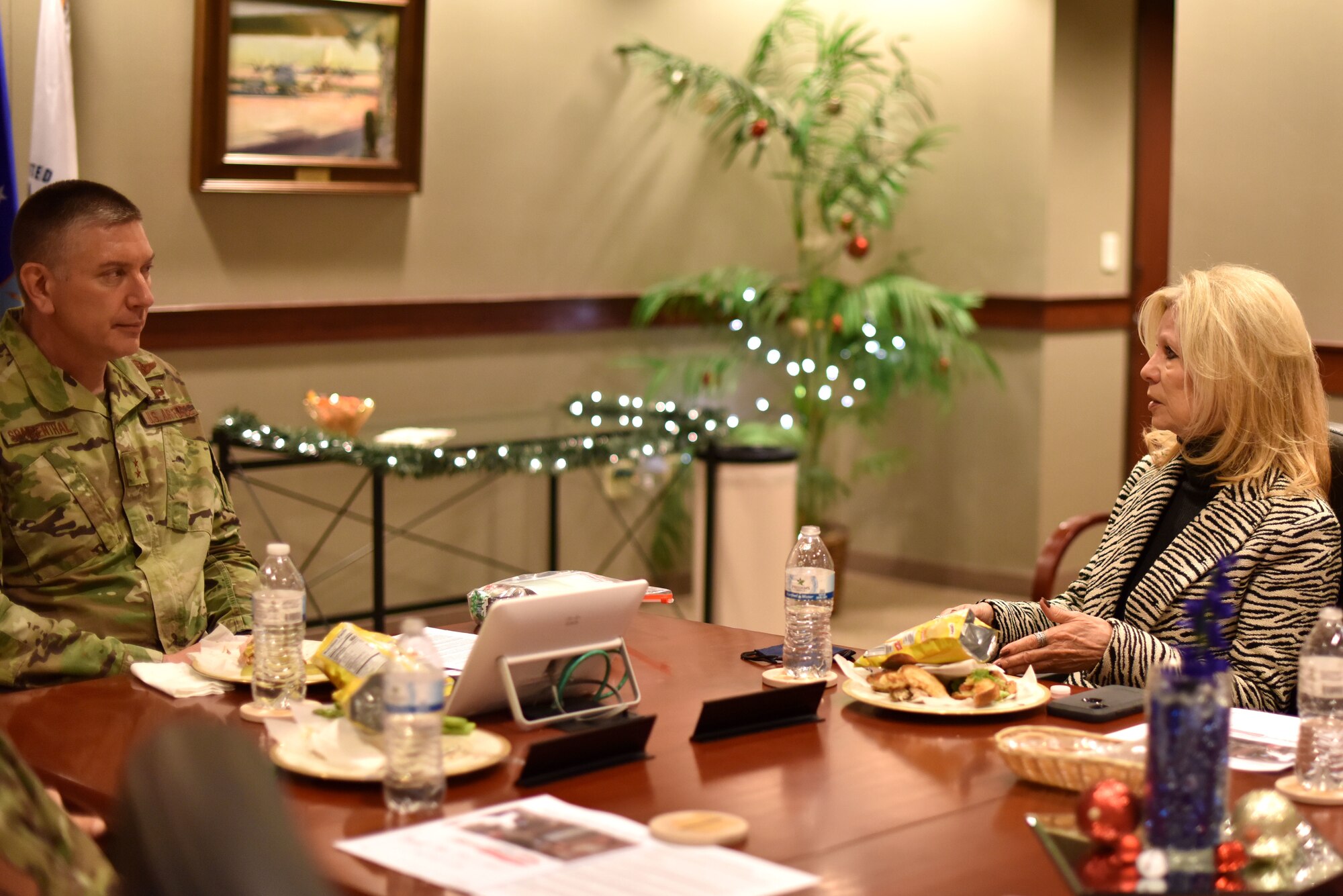 U.S. Air Force Maj. Gen. William Spangenthal, Air Education and Training Command deputy commander, discusses community partnerships with San Angelo Mayor Brenda Gunter during a lunch in the Norma Brown Building on Goodfellow Air Force Base, Texas, Dec. 2, 2020. Goodfellow and San Angelo share a partnership that stretches back to when Goodfellow was first established. (U.S. Air Force photo by Staff Sgt. Seraiah Wolf)