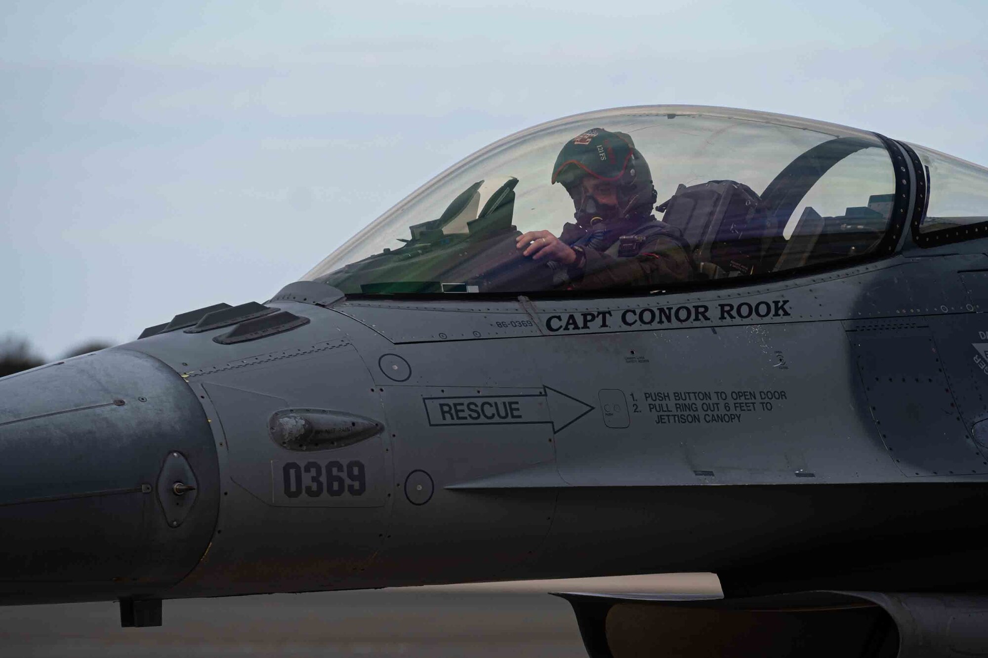 1st Lt. Jason Grubb, 121st Fighter Squadron pilot, does a pre-flight check on an F-15 Fighting Falcon assigned to the 121st Fighter Squadron at Joint Base Andrews, Maryland, while at Dover Air Force Base, Delaware, Nov. 25, 2020. The aircraft stopped at Dover Air Force Base during a training mission. The base prioritizes providing unrivaled installation support for mission partners, transit aircraft and neighboring installations.  (U.S. Air Force photo by Airman 1st Class Faith Schaefer)
