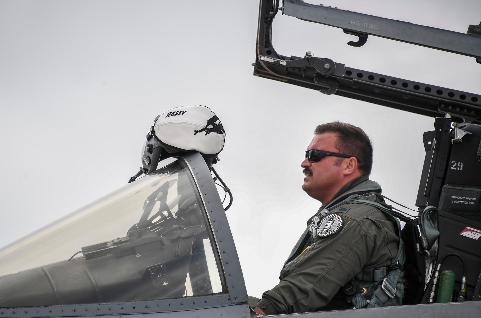 Lt. Col. Jonathan Burd, 194th Fighter Squadron pilot, puts on his helmet for his return home flight after  exercise Checkered Flag concluded, Tyndall Air Force Base, Florida, Nov. 10, 2020.