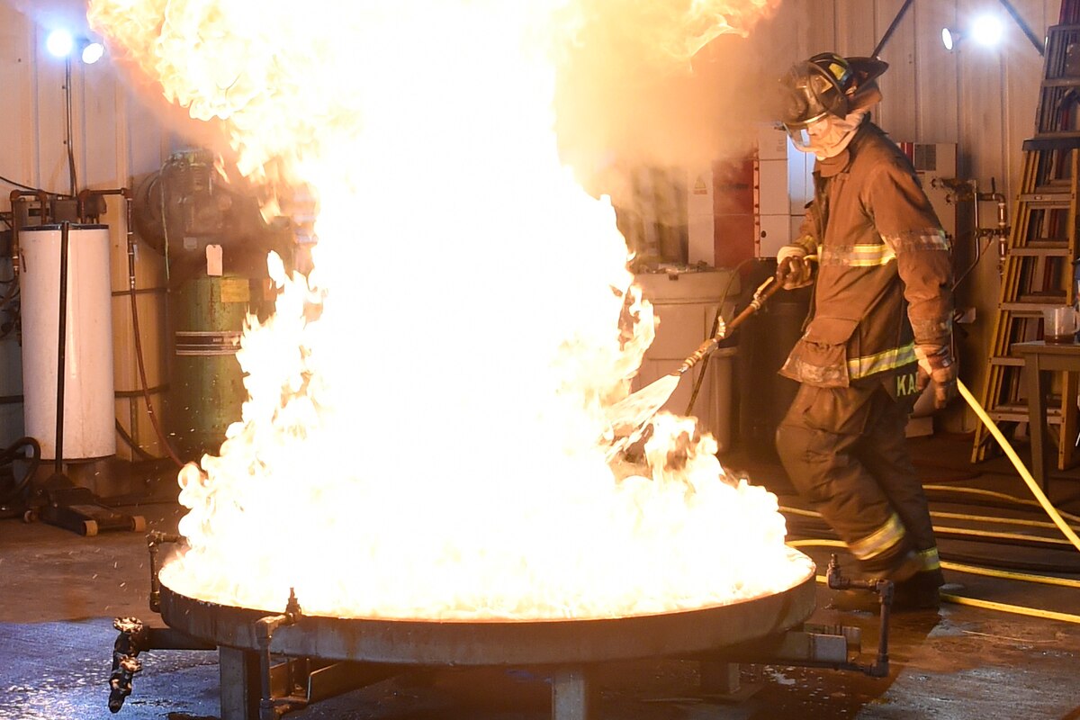 A man puts out a fire.