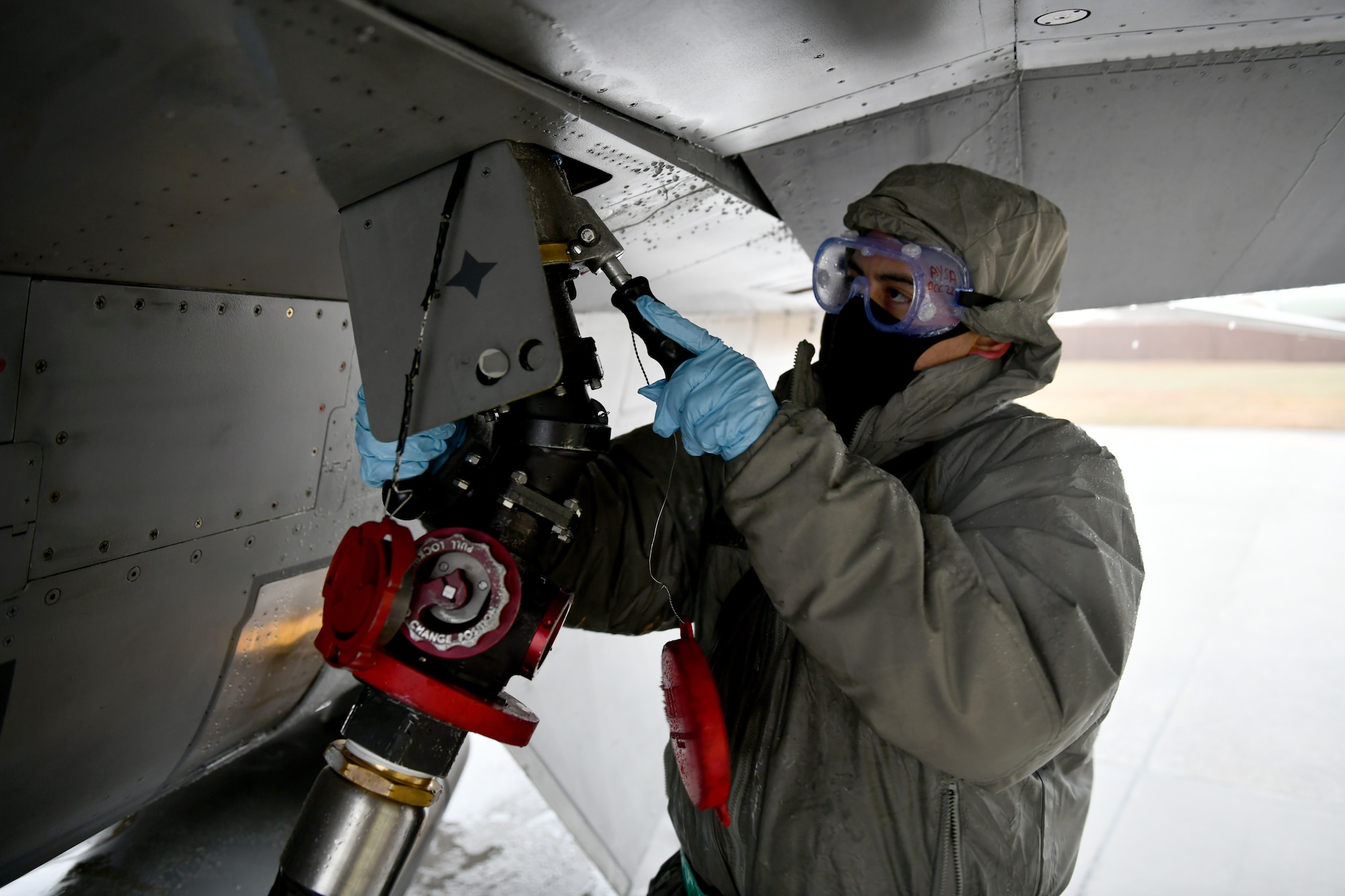 U.S. Air Force Staff Sgt. Andrew Bueno, 555th Aircraft Maintenance Unit crew chief, attaches a fueling line to an F-16 Fighting Falcon at Aviano Air Base, Italy, Dec. 2, 2020. Crew chiefs work alongside many other career fields in the Air Force to ensure the upkeep of aircraft assigned to the wing. Maintenance airmen work around the clock, often in less-than-ideal weather conditions, to keep the wing mission-ready. (U.S. Air Force photo by Staff Sgt. K. Tucker Owen)