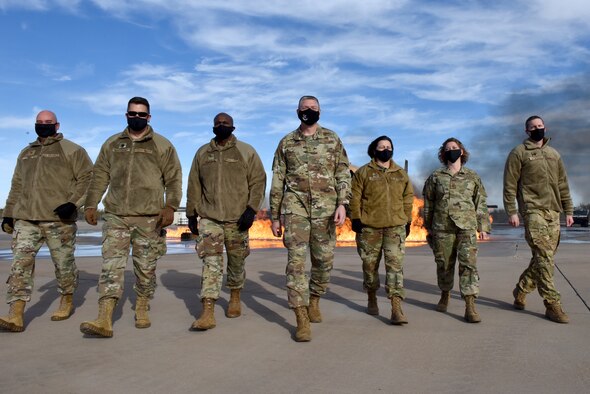U.S. Air Force Maj. Gen. William Spangenthal, Air Education and Training Command deputy commander, walks with Goodfellow leaders on the training pad at the Department of Defense Louis F. Garland Fire Academy on Goodfellow Air Force Base, Texas, Dec. 1, 2020. The Academy provides firefighting training to all DoD components in the Army, Marine Corps, Navy, Air Force, and Coast Guard. (U.S. Air Force photo by Staff Sgt. Seraiah Wolf)