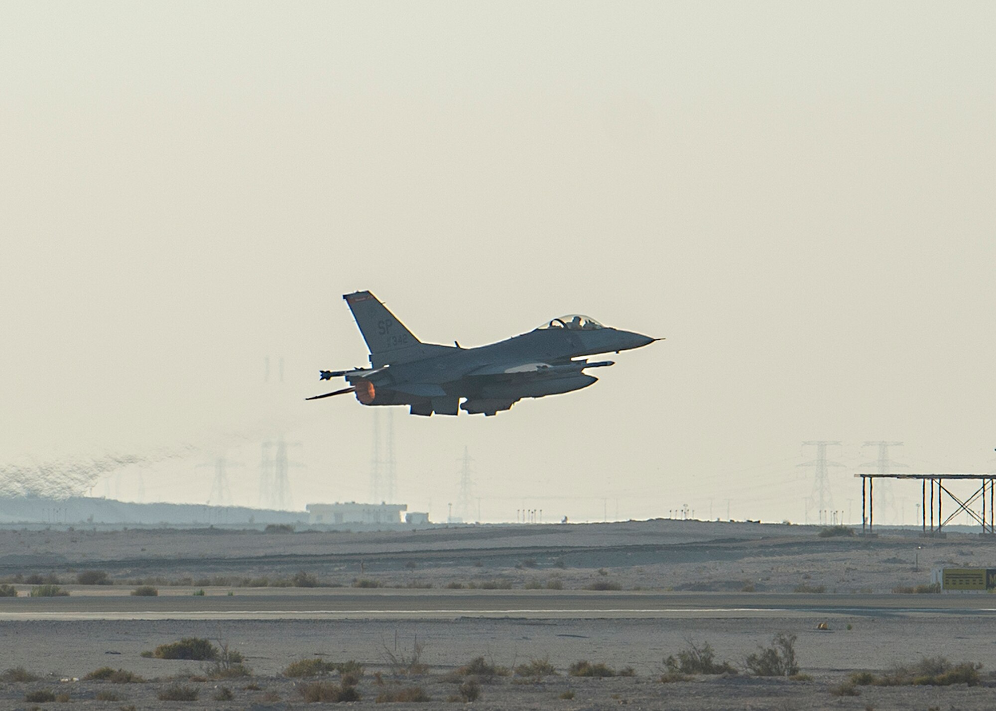 A U.S. Air Force F-16 Fighting Falcon assigned to the 480th Expeditionary Fighter Squadron takes off from Al Dhafra Air Base, United Arab Emirates, Dec. 2, 2020. The F-16 has 27,000 pounds of thrust, allowing it to complete its mission as a compact, multi-role fighter aircraft. (U.S. Air Force photo by Senior Airman Bryan Guthrie)