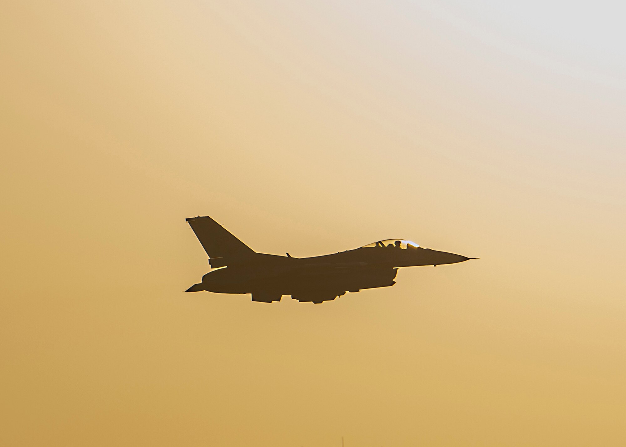 A U.S. Air Force F-16 Fighting Falcon assigned to the 480th Expeditionary Fighter Squadron flies over Al Dhafra Air Base, United Arab Emirates, Dec. 2, 2020. Deploying as an instrument of Dynamic Force Employment, a detachment of F-16s along with squadron personnel from Spangdahlem Air Base, Germany, rapidly integrated into theater air training, as well as joint, coalition and partnered missions. (U.S. Air Force photo by Senior Airman Bryan Guthrie)