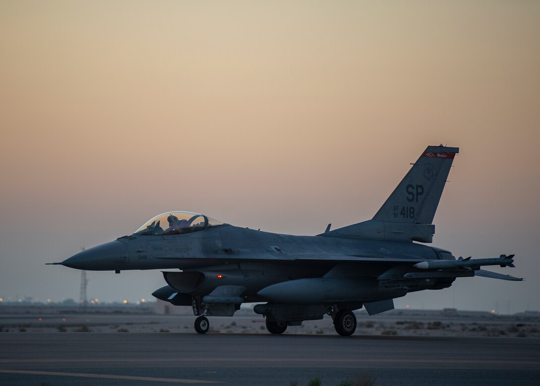 A U.S. Air Force F-16 Fighting Falcon assigned to the 480th Expeditionary Fighter Squadron (EFS) taxis at Al Dhafra Air Base, United Arab Emirates, Dec. 2, 2020. The 480th EFS allows U.S. Central Command commanders to conduct dynamic operations and force employment to deliver joint force commanders the critical capability to move forces fluidly into and across the theater in order to seize, retain and exploit the initiative against an adversary. (U.S. Air Force photo by Senior Airman Bryan Guthrie)