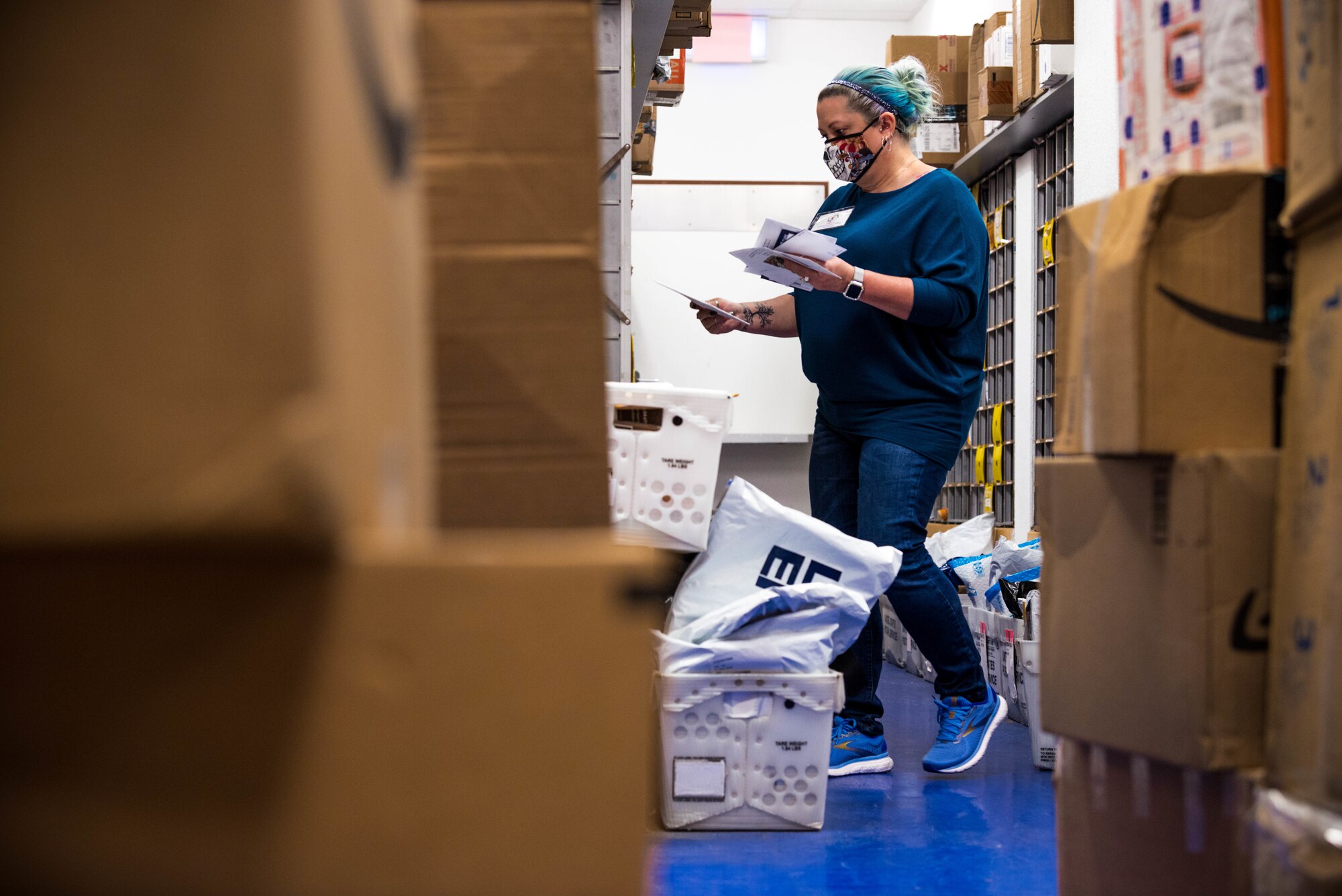 A volunteer sorts mail.