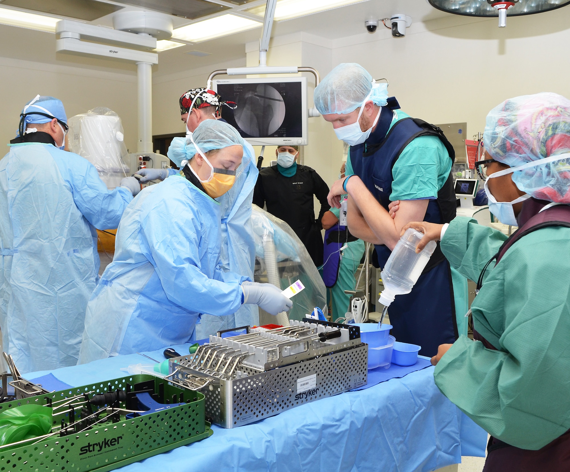 Members of the 555th Forward Resuscitative Surgical Team helping the CRDAMC surgical team in prepping for surgery.