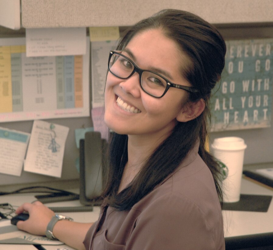 Stephanie Nguyen, a materiel planner in DLA Troop Support’s Industrial Hardware supply chain, poses at her desk Oct. 23, 2019 in Philadelphia.