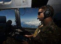 1st Lt. Jake Niedbalski, a C-17 Globemaster III pilot assigned to the 15th Airlift Squadron at Joint Base Charleston, S.C., flies over the Caribbean Sea en-route to Naval Station Guantanamo Bay (NSGB), Cuba, Nov. 12, 2020. The 15th AS flew an off-station trainer to NSGB to deliver two Halverson loaders and bring two Halverson loaders back to Charleston. The aircrew also conducted airfield and low-level training at Guantanamo Bay, Cuba, the Florida Keys, Lakeland Linder International Airport and Patrick Air Force Base. Two Airmen, assigned to the 628th Logistics Readiness Squadron at Joint Base Charleston, repaired two loaders before they were loaded onto the jet.