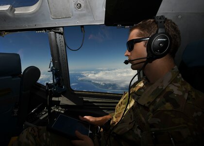 1st Lt. Jake Niedbalski, a C-17 Globemaster III pilot assigned to the 15th Airlift Squadron at Joint Base Charleston, S.C., flies over the Caribbean Sea en-route to Naval Station Guantanamo Bay (NSGB), Cuba, Nov. 12, 2020. The 15th AS flew an off-station trainer to NSGB to deliver two Halverson loaders and bring two Halverson loaders back to Charleston. The aircrew also conducted airfield and low-level training at Guantanamo Bay, Cuba, the Florida Keys, Lakeland Linder International Airport and Patrick Air Force Base. Two Airmen, assigned to the 628th Logistics Readiness Squadron at Joint Base Charleston, repaired two loaders before they were loaded onto the jet.