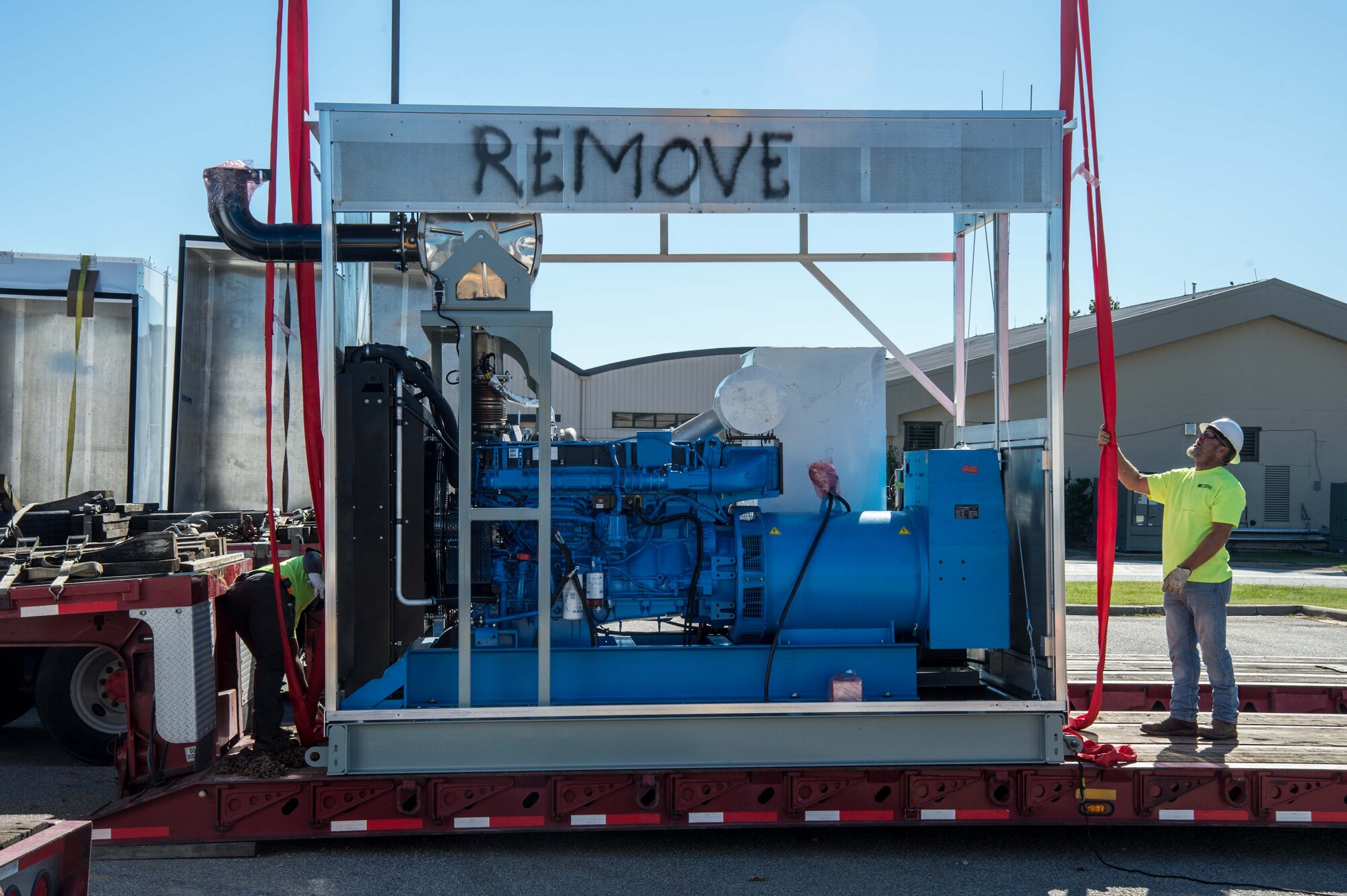 Contractors assemble a microgrid at a construction site.