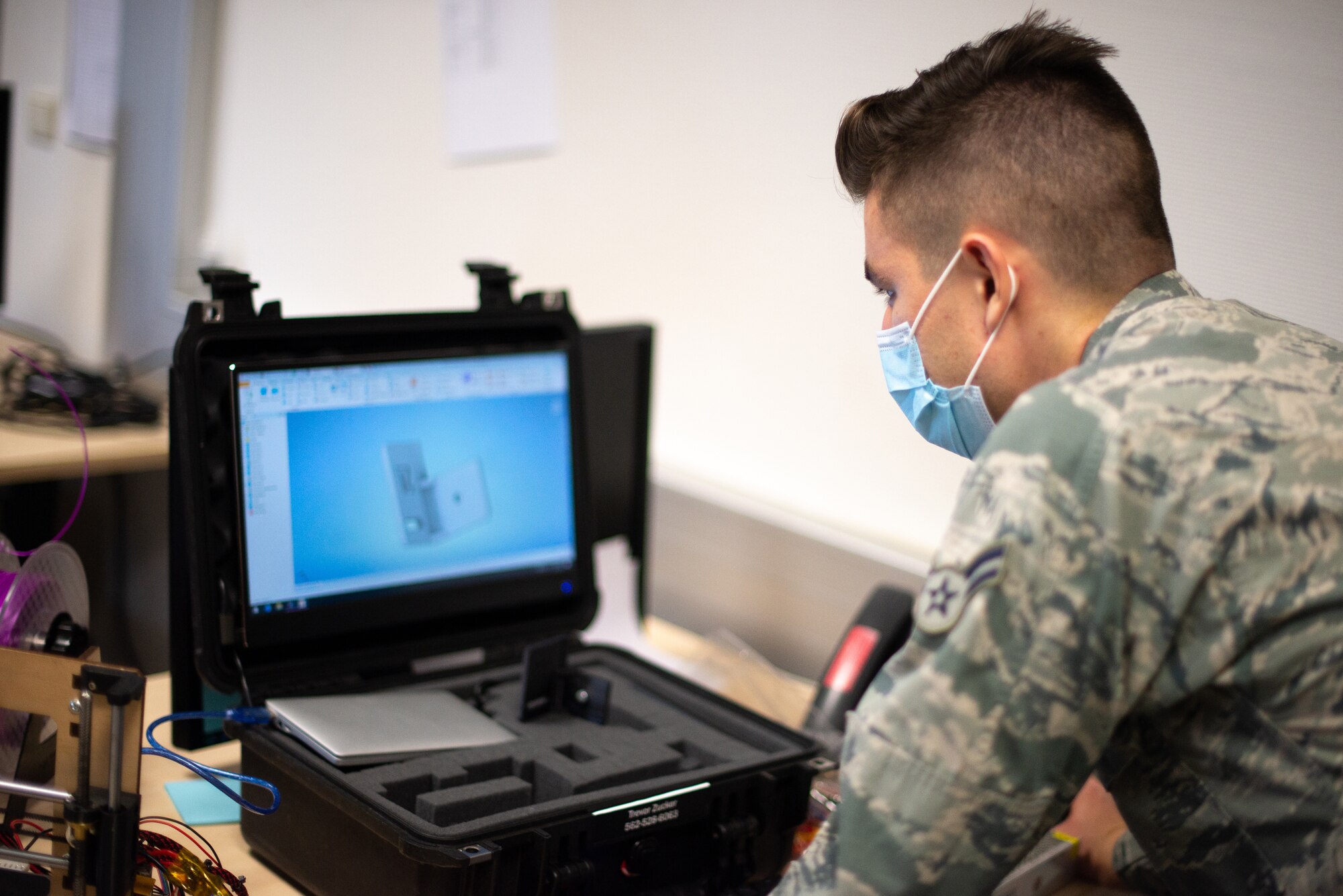 airman works on computer