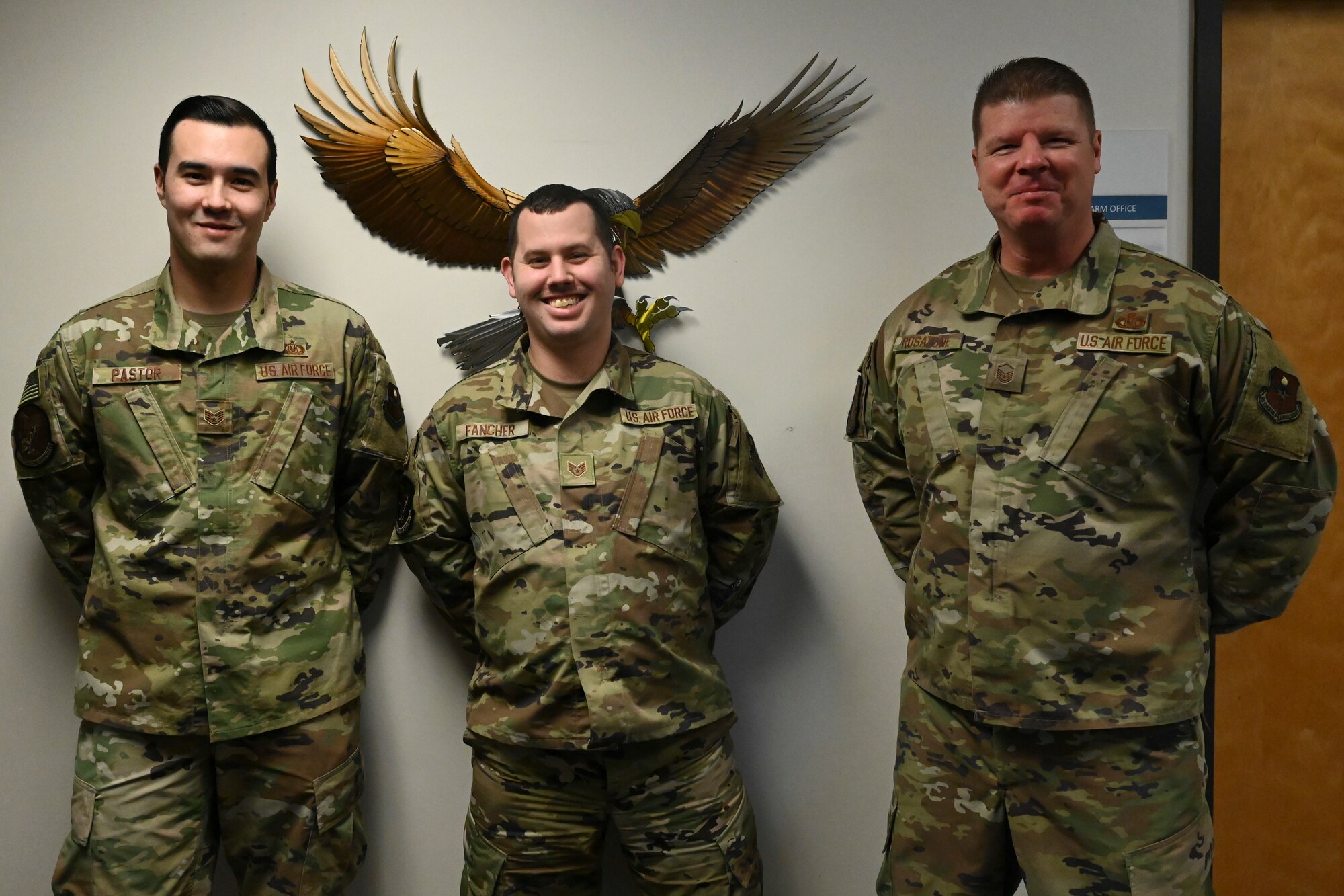 U.S. Air Force Staff Sgt. Indiana Pastor (left), Staff Sgt. Nathan Fancher, and Master Sgt. Michael Rosatone, all assigned to the 14th Operations Support Squadron, pose for a photo Dec. 2, 2020 on Columbus Air Force Base, Miss. Rosatone received the Air Education and Training Command Outstanding Aircraft Flight Equipment Senior Non Commissioned Officer of the Year Award for 2020. (U.S. Air Force photo by Airman 1st Class Jessica Williams)