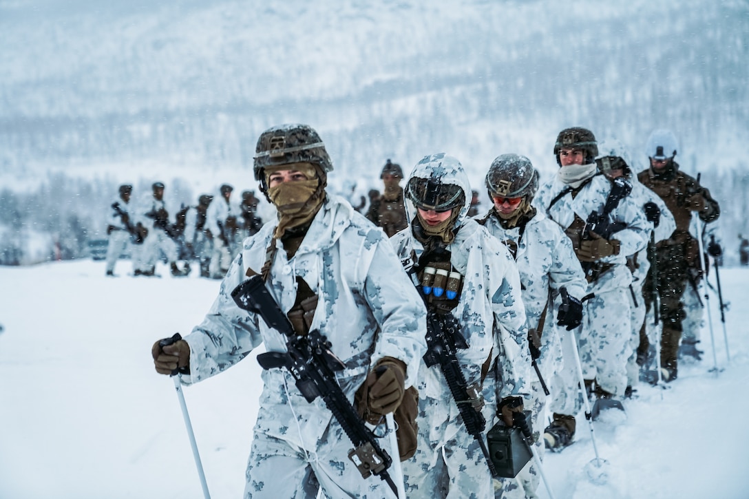 U.S. Marines hike through snow during a cold weather live-fire training event in preparation for Exercise Reindeer II in Setermoen, Norway, Nov. 20.