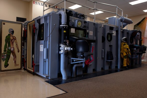 The altitude chamber stands in the lobby of the aerospace physiology building waiting to usher in new pilots into the first steps of training on Dec. 1, 2020, Laughlin Air Force Base, Texas. A chamber used during aerospace or high terrestrial altitude research or training to simulate the effects of high altitude on the human body, especially hypoxia. (U.S. Air Force photo by Airman 1st Class David Phaff)