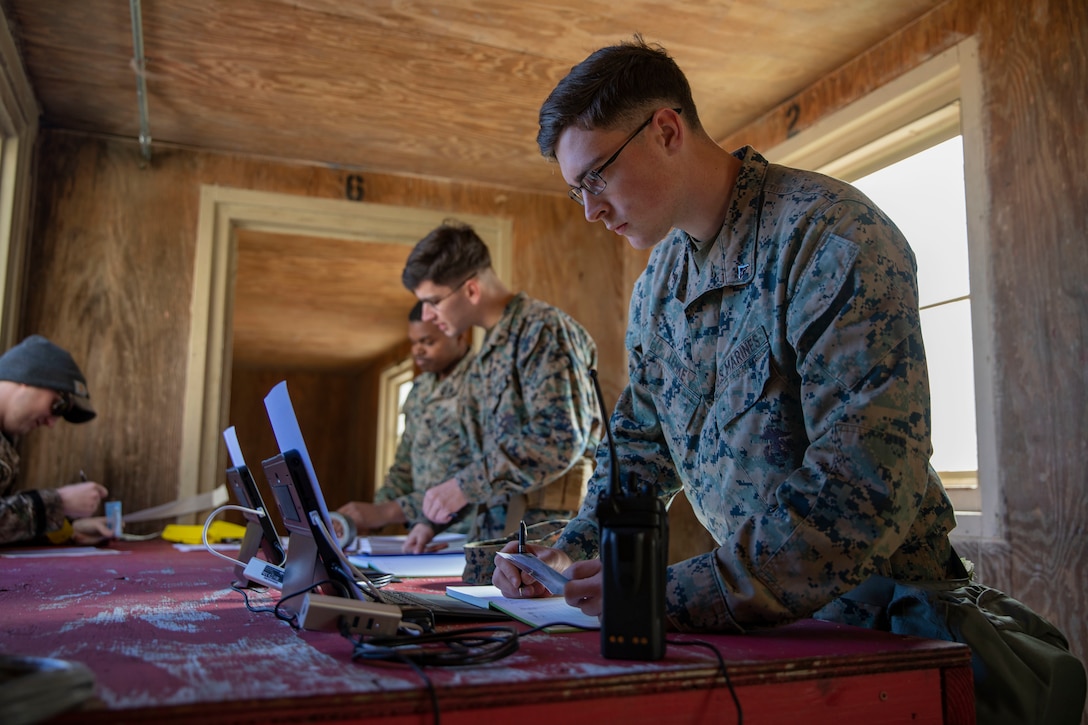 U.S. Marine Lance Cpl. Samuel Lemke, a landing support specialist with Combat Logistics Battalion 22, 22nd Marine Expeditionary Unit verifies the credentials of role players during a noncombatant evacuation operation training exercise aboard Camp Geiger, N.C., Feb. 27, 2020. Instructors with the Expeditionary Operations Training Group used the exercise to evaluate the unit’s ability to evacuate civilian noncombatants from a danger area to a designated safe haven in an overseas country. (U.S. Marine Corps photo by Cpl. Antonio Garcia)