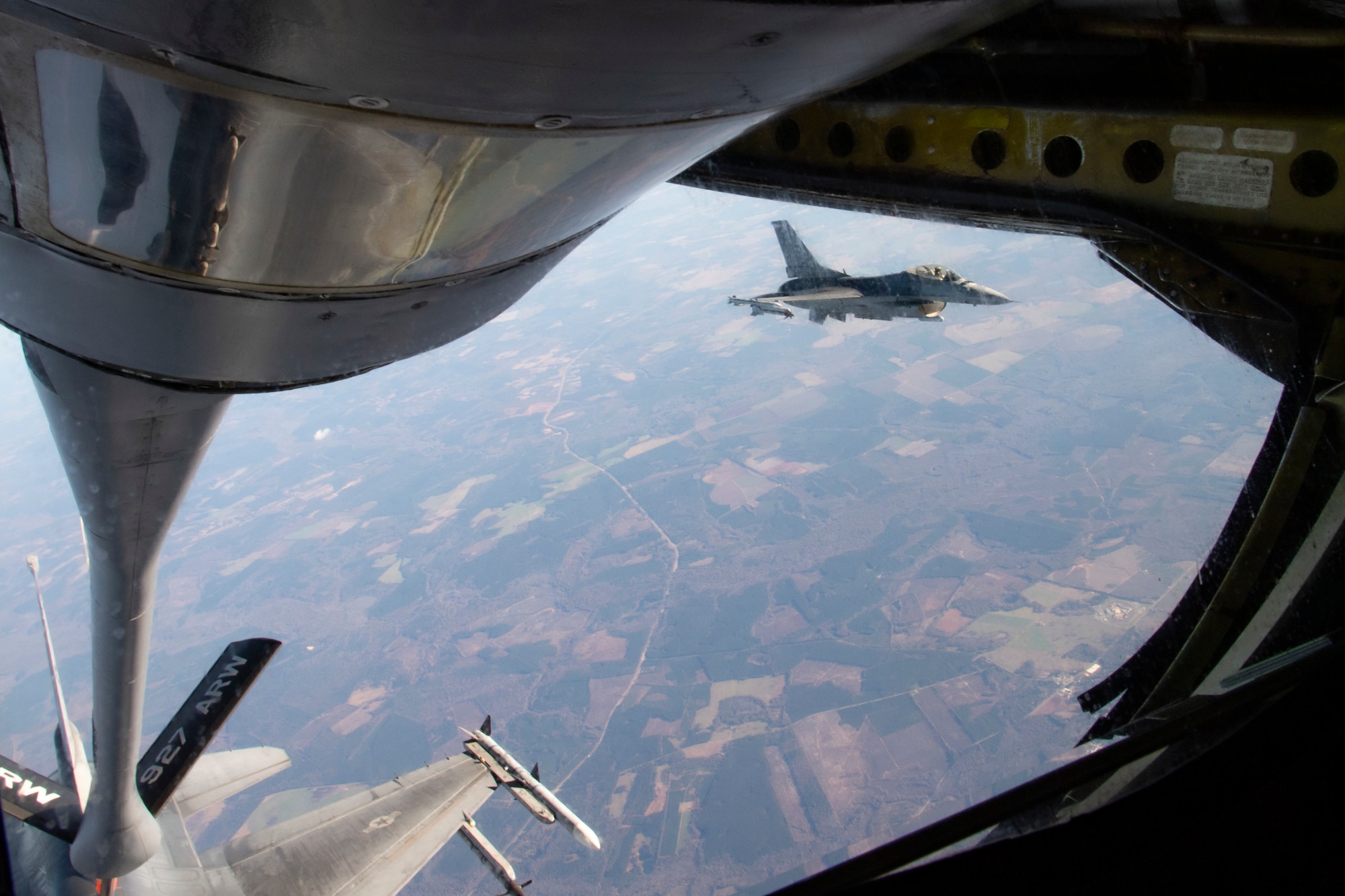 Two F-16 Fighting Falcon aircraft assigned to Shaw Air Force Base (AFB), South Carolina, fly in formation to receive air refueling support from a KC-135 Stratotanker assigned to MacDill AFB, Fla., Dec. 1, 2020.