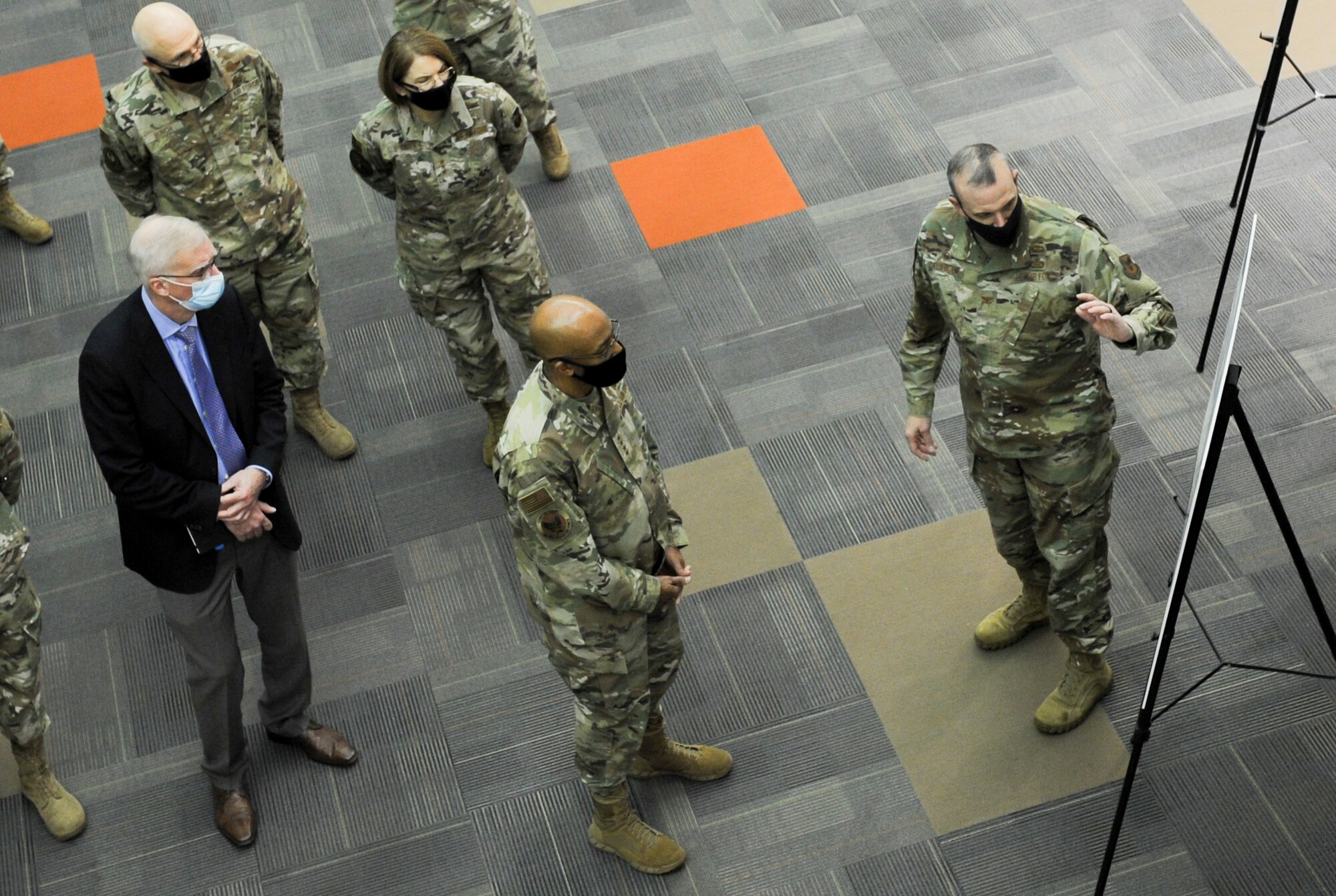 Col. Maurizio Calabrese, National Air and Space Intelligence Center Commander, briefs Air Force Chief of Staff Gen. Charles Q. Brown, Jr. during the CSAF’s trip to Wright-Patterson Air Force Base, Ohio Dec. 3, 2020. As Air Force senior leaders look on, Calabrese explained to the Chief of Staff what NASIC is doing to accelerate the foundational scientific and technical intelligence needed to enable joint all-domain command and control. (U.S. Air Force photo by Senior Airman Samuel Earick)