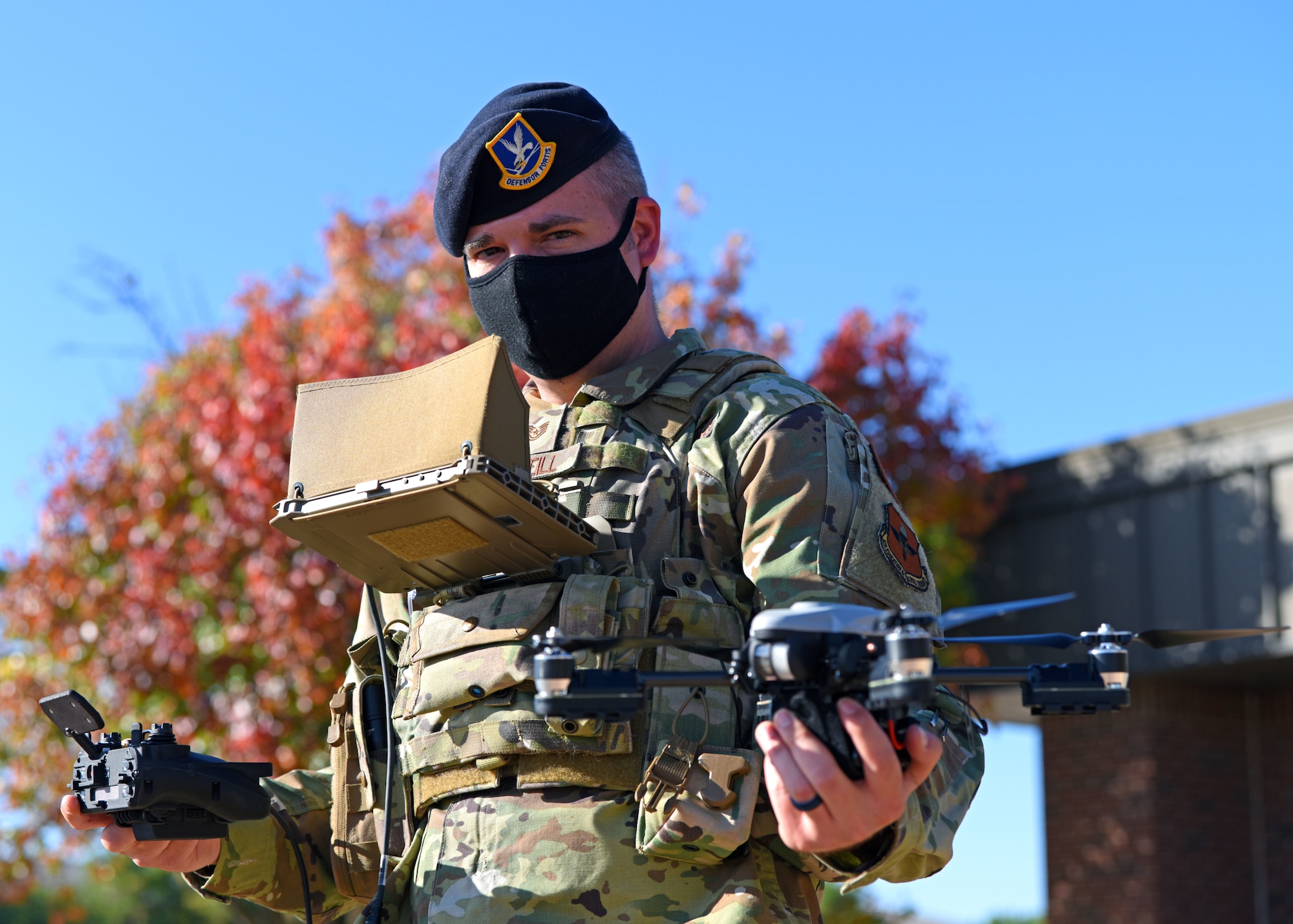 U.S. Air Force Tech. Sgt. Kyle McNeill, 17th Security Forces Squadron bravo flight chief and certified drone operator, displays a drone, which offers force multiplier technology and epitomizes the Air Force’s unparalleled air power. McNeill has served in the Air Force for 14 years and strives to create an environment open to new ideas, new training and new technology. (U.S. Air Force photo by Airman 1st Class Ethan Sherwood)