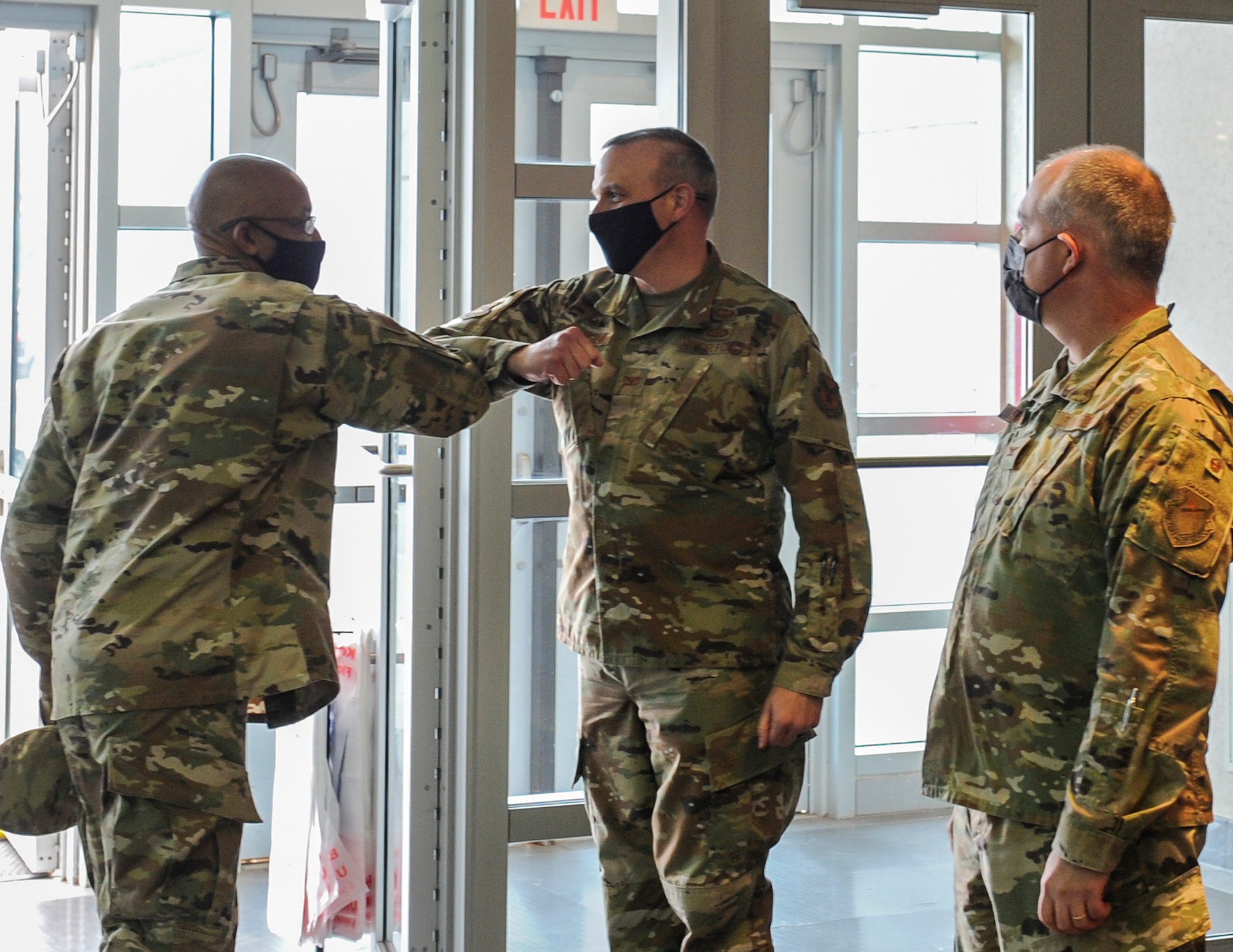 Col. Maurizio Calabrese, National Air and Space Intelligence Center Commander (center), and Col. Paul Harmer, NASIC Vice Commaner (right), welcome Air Force Chief of Staff Gen. Charles Q. Brown, Jr. to NASIC for a short tour and a series of intelligence briefings during his trip to Wright-Patterson Air Force Base, Ohio Dec. 3, 2020. Brown’s visit focused heavily on NASIC’s role as a service intelligence center, providing the foundational intelligence required for both the Air Force and Space Force to maintain a competitive advantage. (U.S. Air Force photo by Senior Airman Samuel Earick)