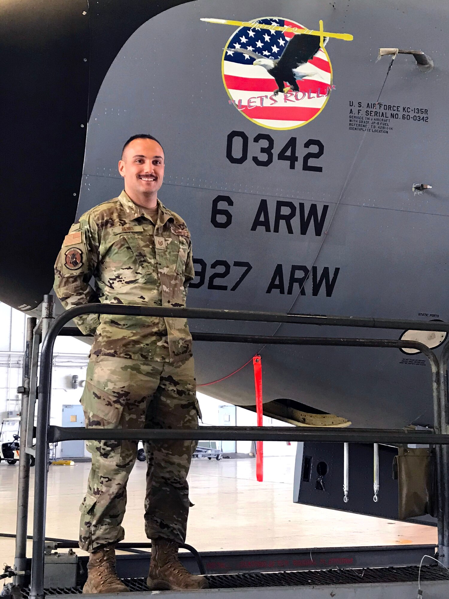 U.S. Air Force Tech. Sgt. Nicholas Benko , a 927th Aircraft Maintenance Squadron dedicated crew chief, stands proudly by a 9/11 remembrance decal on KC-135 Stratotanker aircraft number ‘0342’ in Hangar 3 at MacDill Air Force Base, Fla., Dec. 4, 2020.
