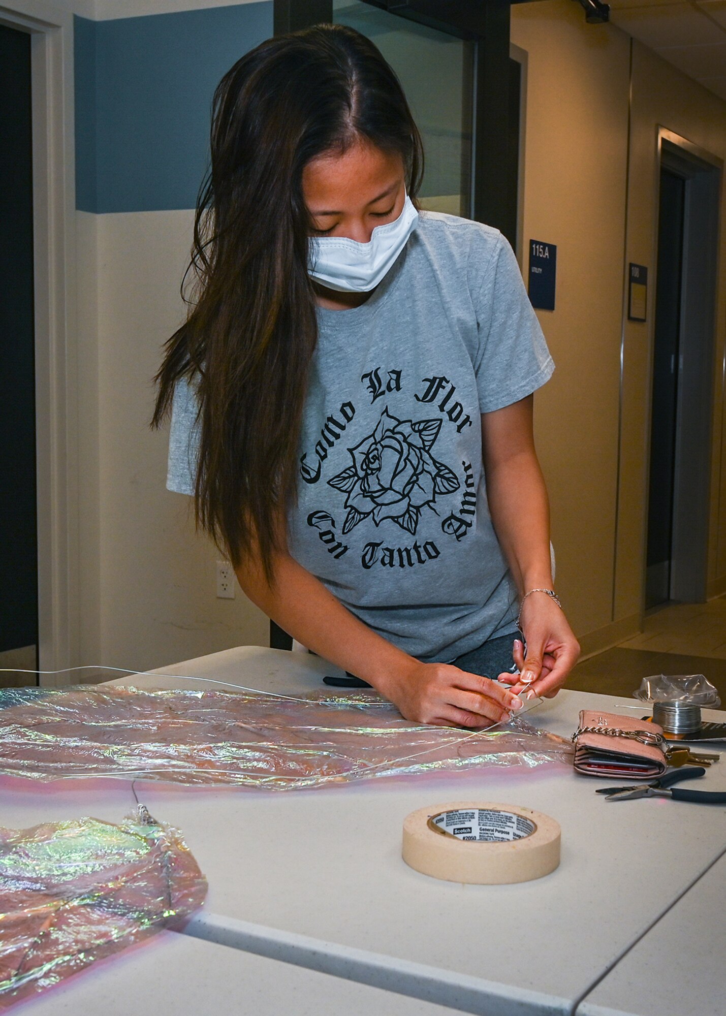 Airman 1st Class Emangelyn Pascua, Hanscom Dorm Council member, wires together a costume for the holiday parade and tree lighting at Hanscom Air Force Base, Mass., Dec. 3. Pascua handmade four costumes for council members to wear during the parade. (U.S. Air Force photo by Todd Maki)