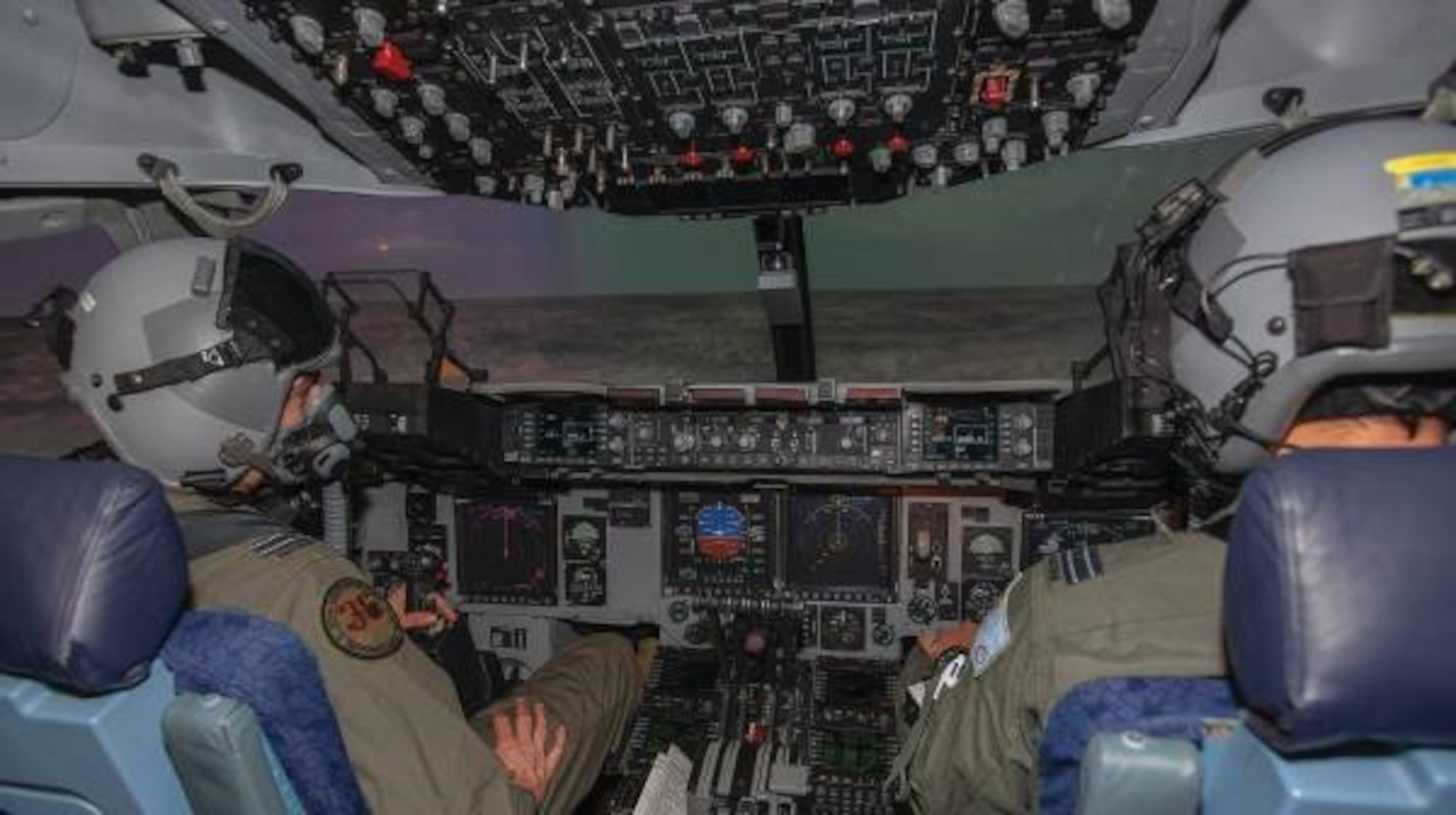 Pilots flying a mission in the C-17A Globemaster III simulator at RAAF Base Amberley (Courtesy photo)