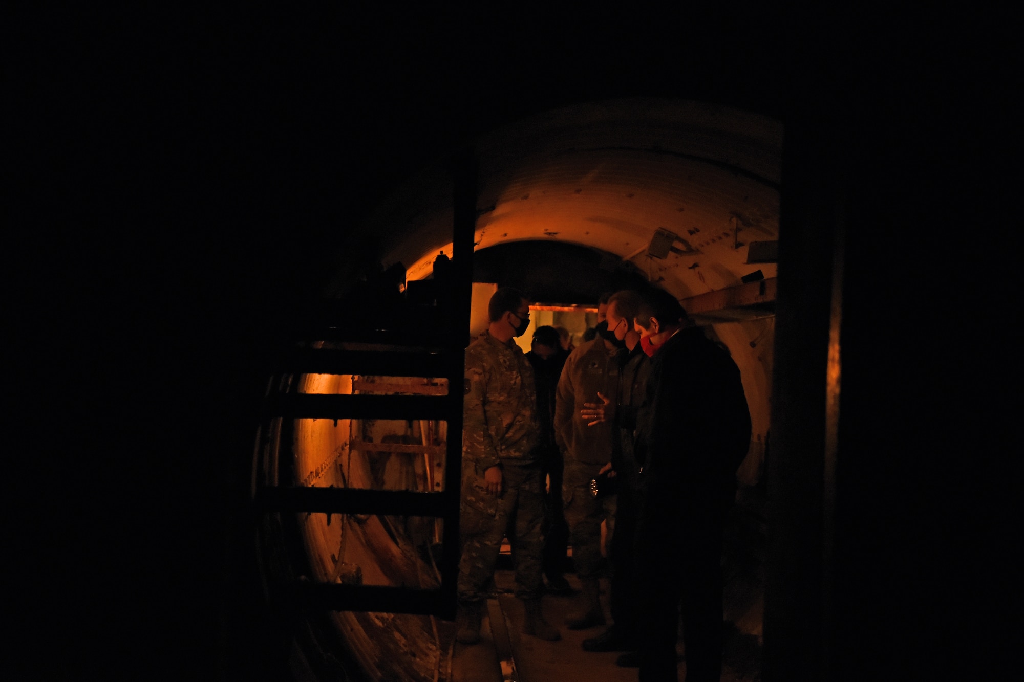 U.S. Air Force members of Goodfellow Air Force Base learn the significance of Lawn Atlas Missile Base’s thick blast doors inside the tunnel on the way to the missile silo in Lawn, Texas, Dec 3, 2020. The underground tunnel connected the main missile silo to a launch control center, which was operated by a five-man crew during the Cold War in 1962. (U.S. Air Force photo by Senior Airman Abbey Rieves)