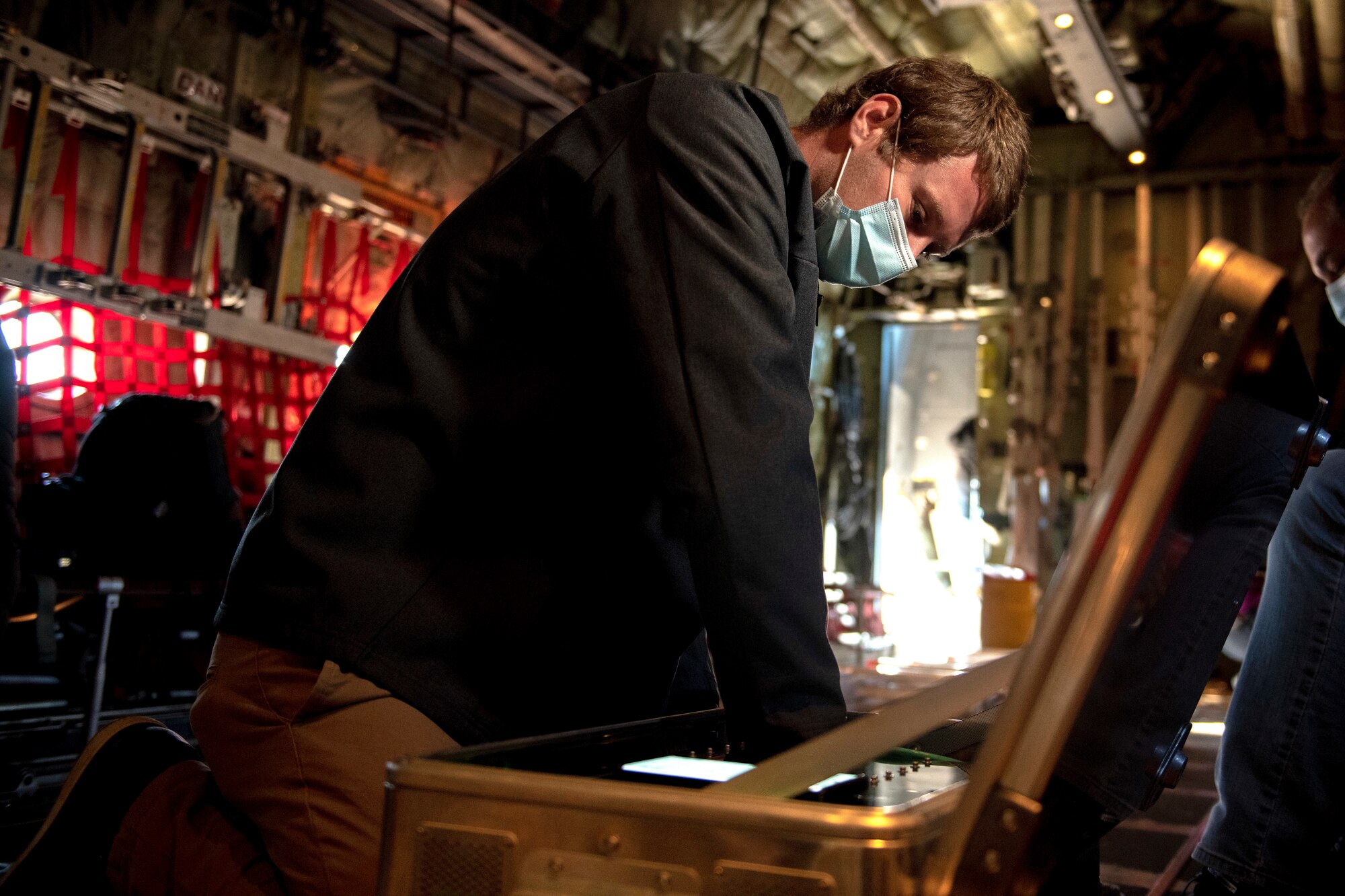 Man working inside aircraft