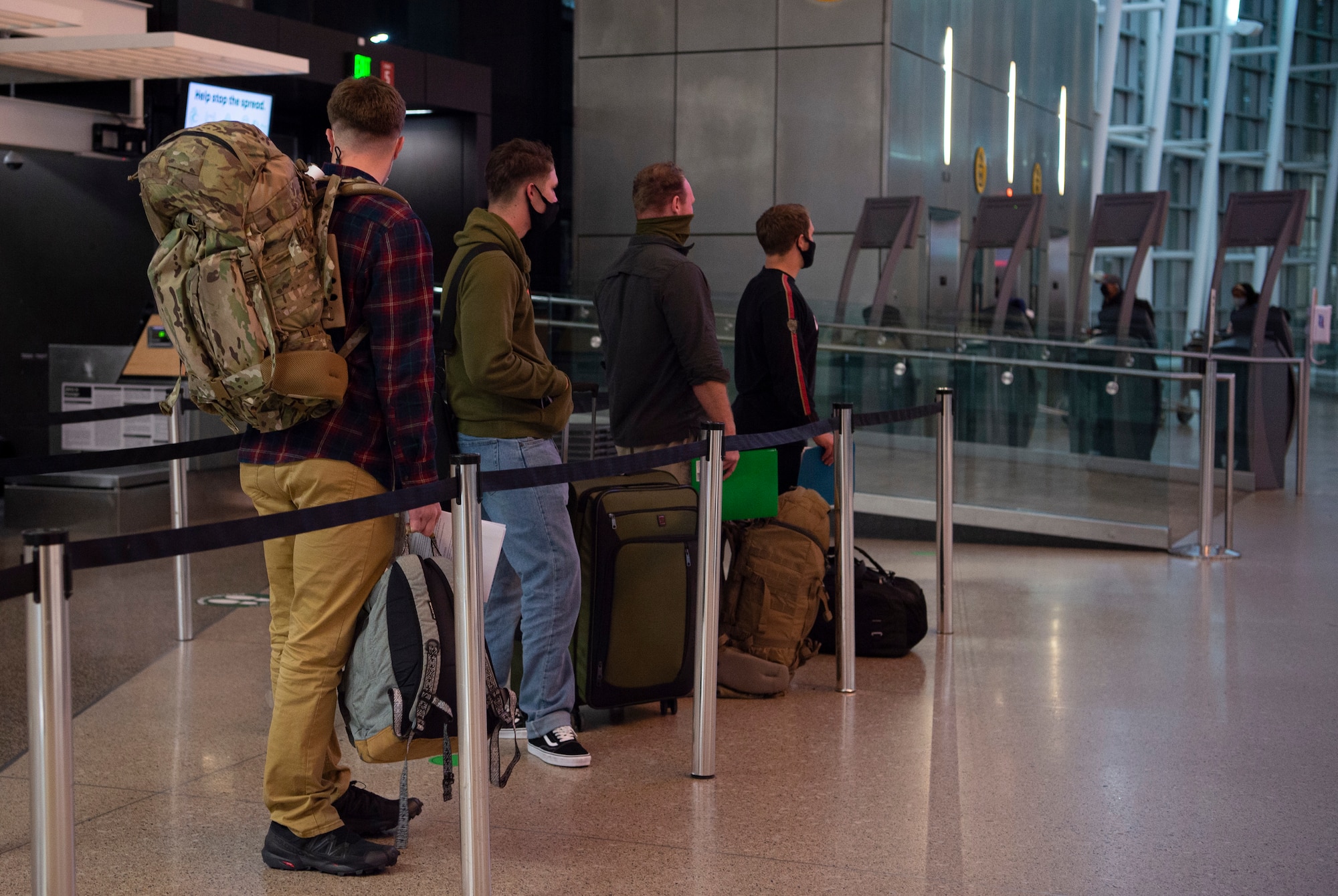 Passengers traveling through the Air Mobility Command terminal at the Seattle-Tacoma International Airport wait to be tested for COVID-19 in Seattle, Dec. 3, 2020. The 62nd Aerial Port Squadron has started random testing for the virus to prevent its spread by passengers traveling through the terminal. (U.S. Air Force photo by Senior Airman Tryphena Mayhugh)