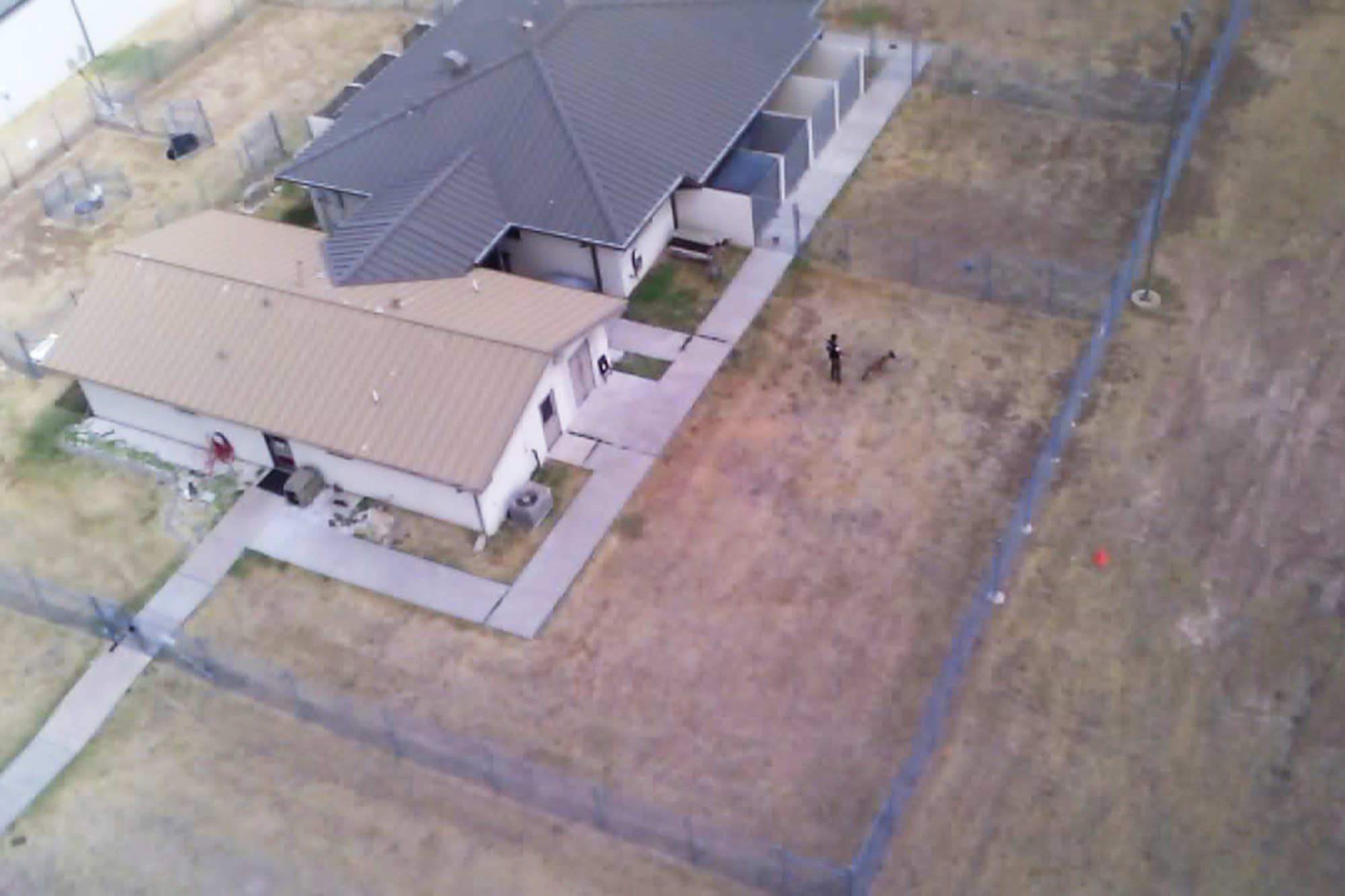 A 17th Security Force Squadron Small Unmanned Aircraft System photo of the Fritz Military Working Dog Kennel on Goodfellow Air Force Base, Texas, September 8, 2020. Drones provided a stand-off distance for possible hostile incidents or active shooters, and created a force multiplier in physical security, search and rescue missions, and other situations beyond human endurance. (U.S. Air Force Small Unmanned Aircraft System courtesy photo)