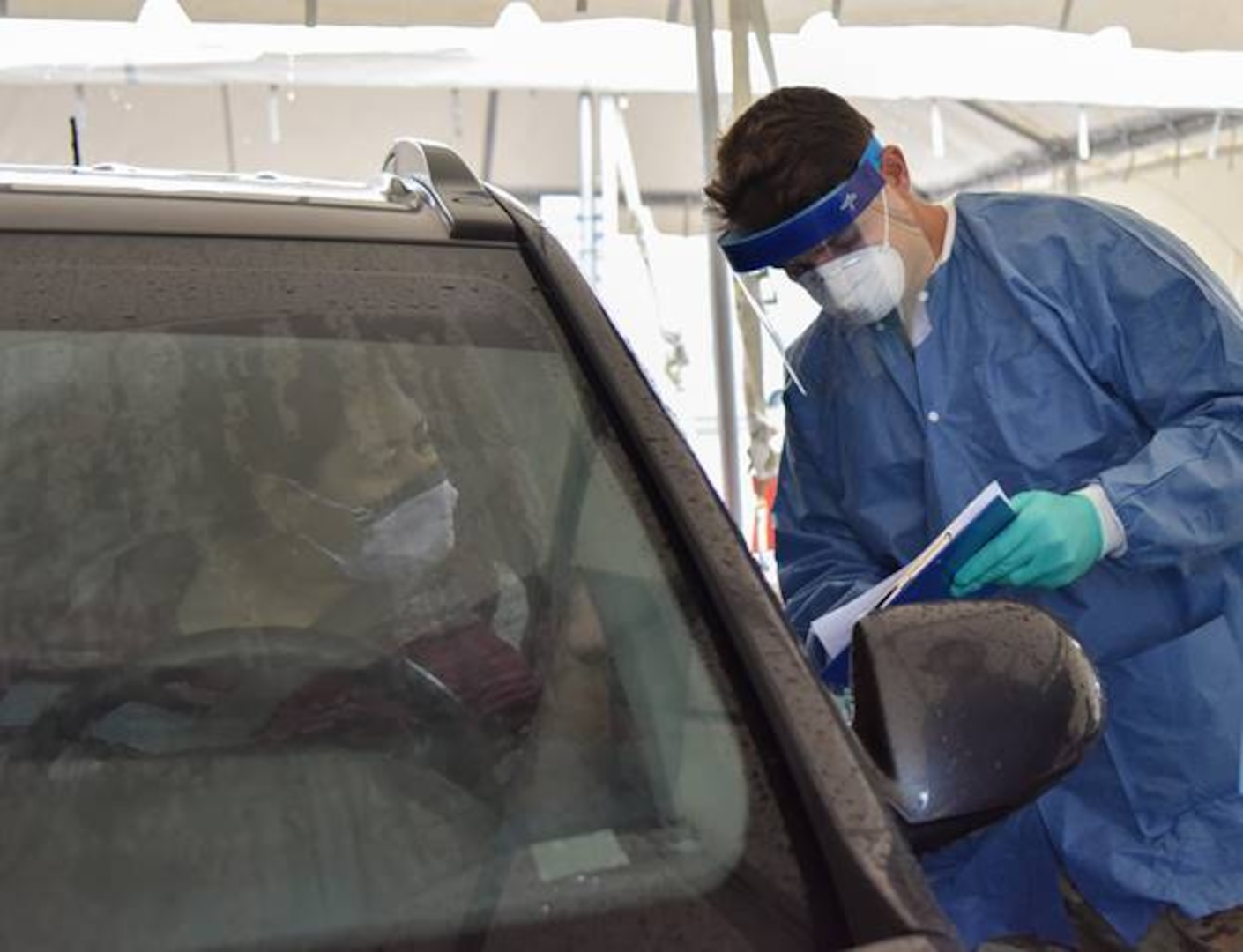 Sgt. Robert Neal, an infantryman with 2nd Squadron, 278th Armored Cavalry Regiment, conducts COVID-19 testing at a drive-thru rural assessment site in Montgomery County, Sept. 28.