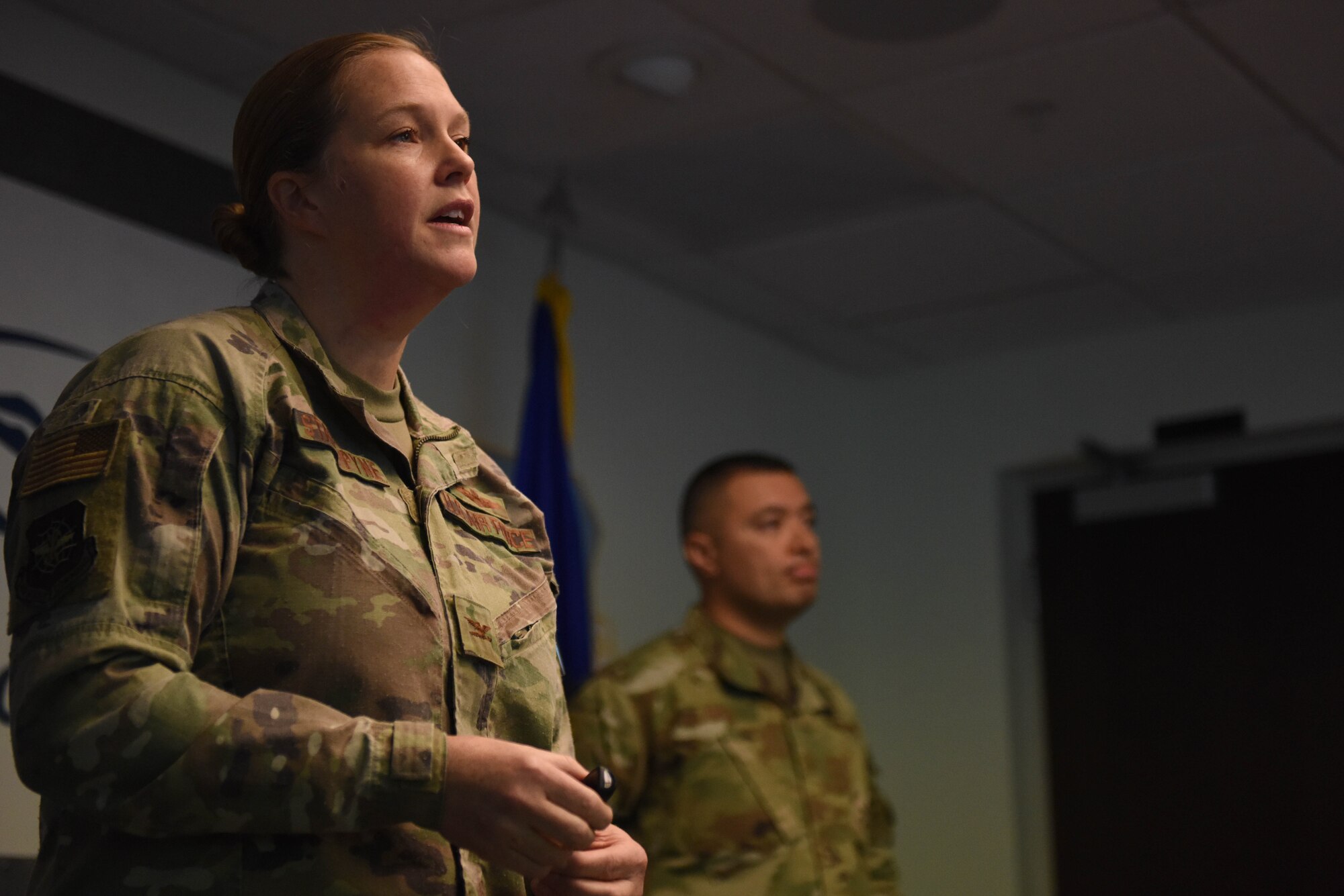 U.S. Air Force Col. Erin Staine-Pyne, 62nd Airlift Wing commander, and Chief Master Sgt. Joseph Arce, 62nd AW command chief, deliver remarks during Wingman Day at Joint Base Lewis-McChord, Wash., Nov. 20, 2020. Wingman Day aims to build resilient Airmen through mental, physical, social and spiritual fitness. (U.S. Air Force photo by Airman 1st Class Callie Norton)