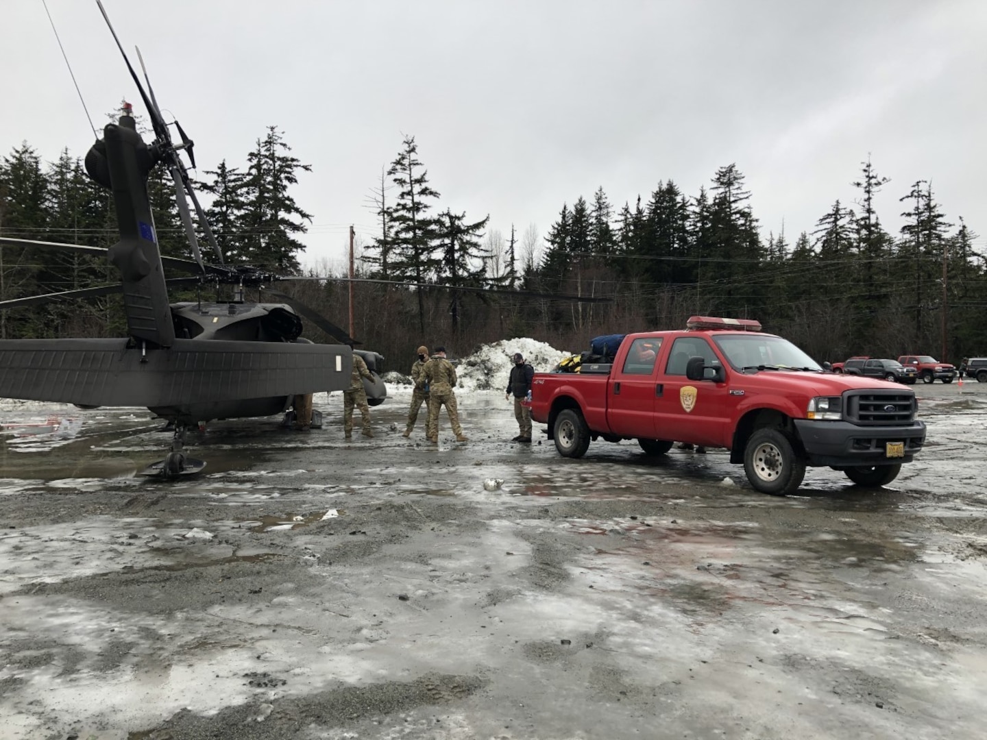 An Alaska Army National Guard UH-60 Black Hawk helicopter conducts search and rescue in Haines after a major landslide on Dec. 3, 2020.