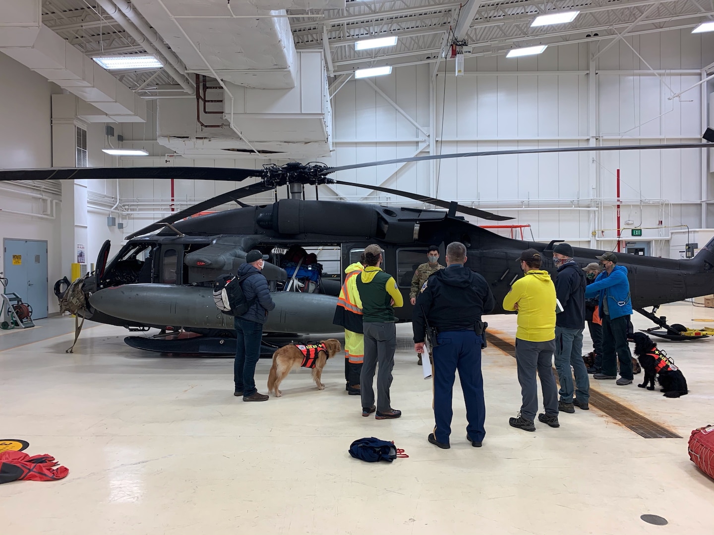 Spc. Thomas James, UH-60 Black Hawk crew chief with the Alaska Army National Guard, conducts a passenger briefing before departure from the Juneau Airport December 3, 2020.