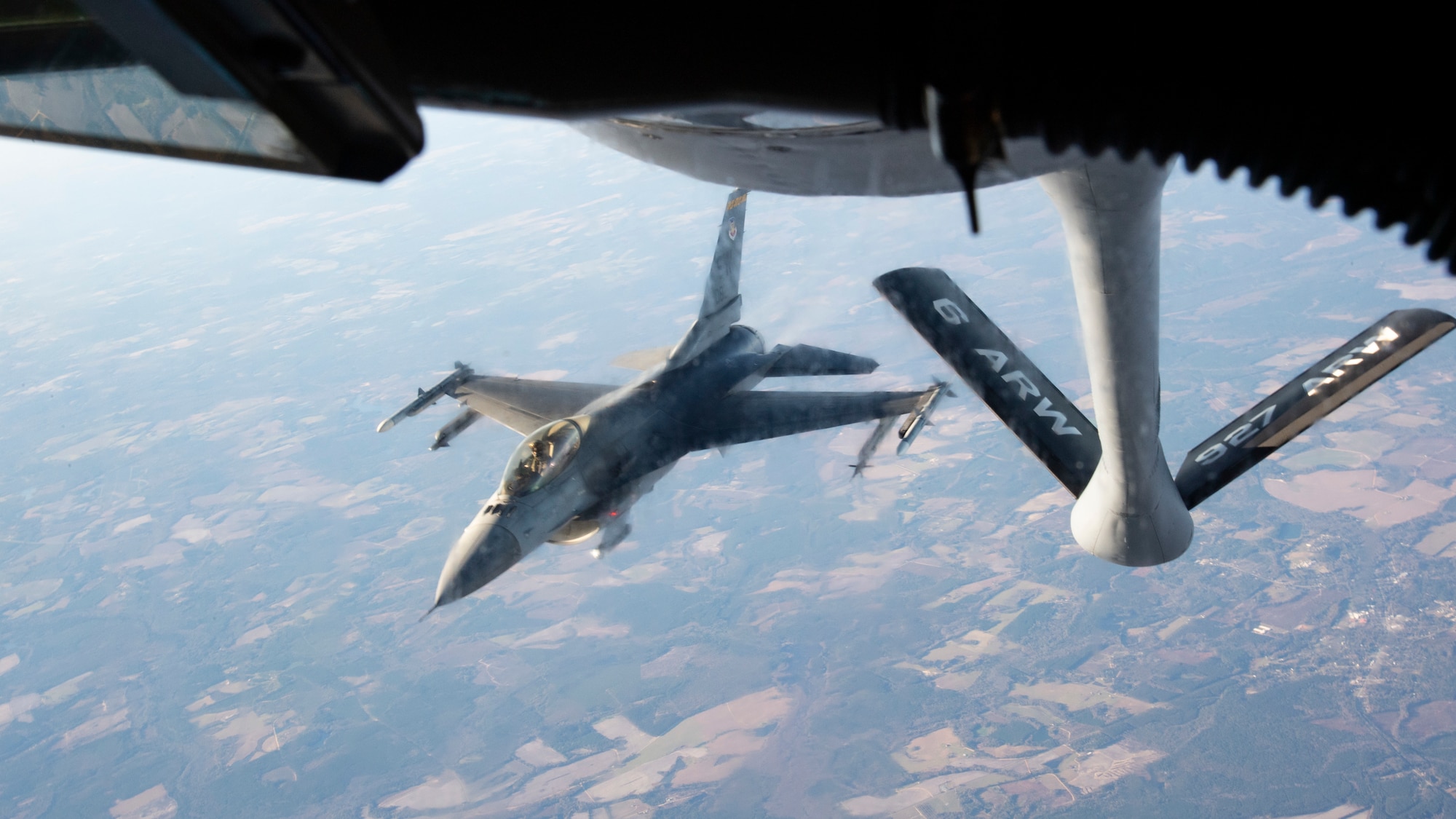 An F-16 Fighting Falcon aircraft assigned to Shaw Air Force Base (AFB), South Carolina, descends after receiving air refueling support from a KC-135 Stratotanker from MacDill AFB, Fla., Dec. 1, 2020.