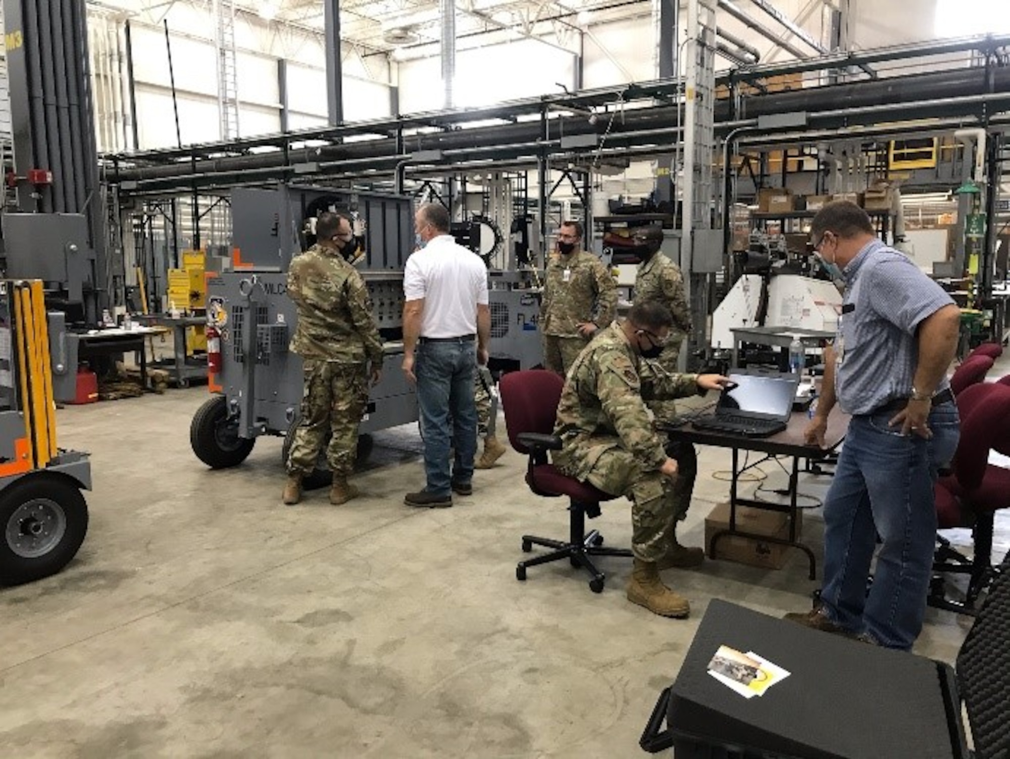 Shown in Advanced Flightline Power and Lighting System (AFPALS) user training conducted by Staff Sgt. Ryan Merritt from Andersen Air Force Base 36th Maintenance Squadron; are Dave Moyer from Concurrent Technologies Corporation, Lt. Stephanie Enloe from Air Force Research Laboratory Materials and Manufacturing Directorate, Technical Sgt. Joe Garner and Staff Sgt. Melvin Jackson from 621 Contingency Response Squadron, Joint Base McQuire-Dix-Lakehurst, Chief Master Sgt. Mark Haralson from Air Force Materiel Command Headquarters and Bryan Tipton from CTC. (U.S. Air Force photo/Tom Layne)