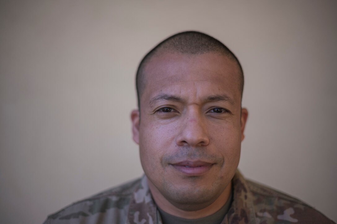 An airman poses for a portrait.