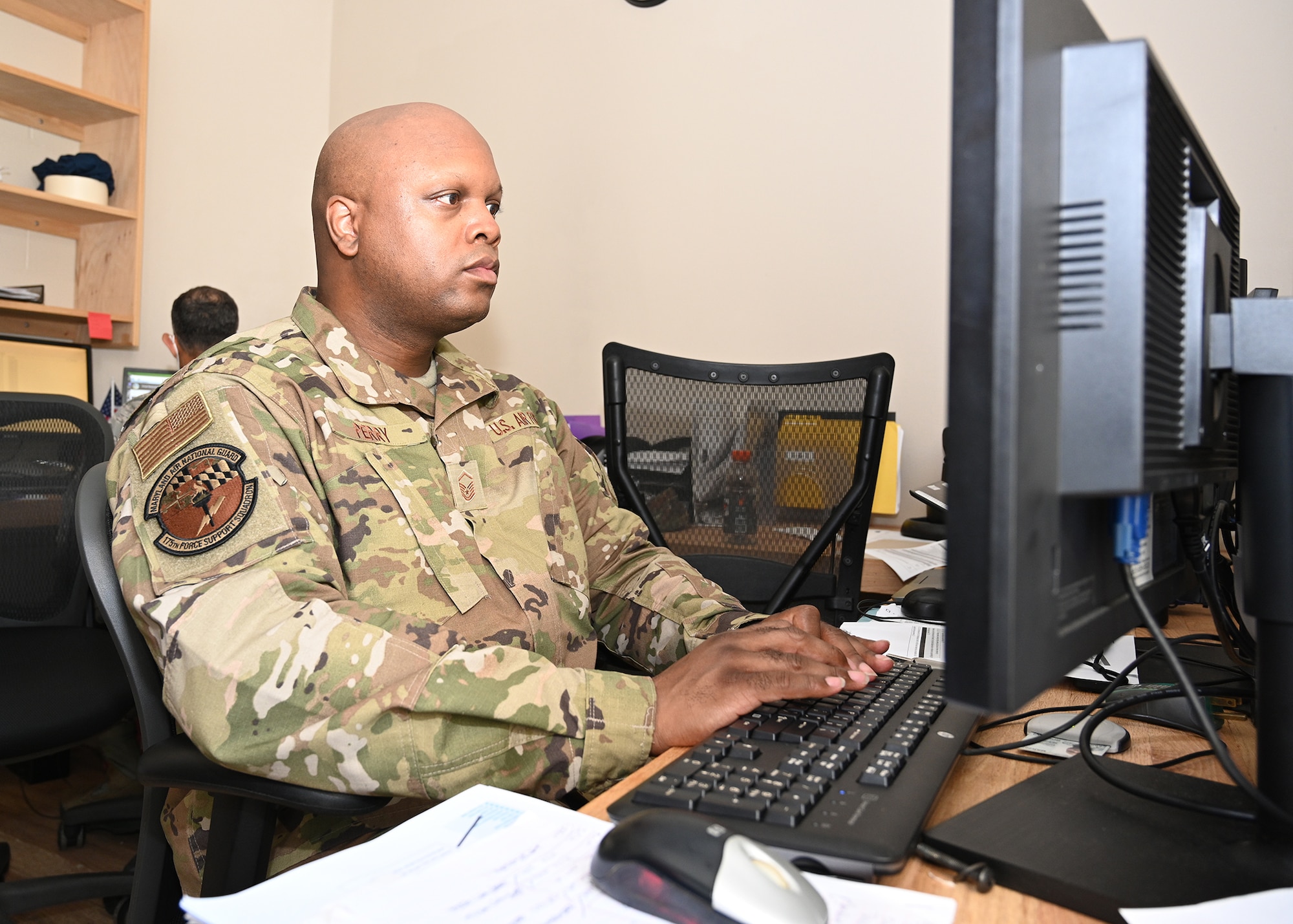 Master Sgt. Robert Perry, 175th Force Support Squadron training manager, works at his computer during a regularly scheduled drill at Warfield Air National Guard Base at Martin State Airport, Sep. 13 2020.