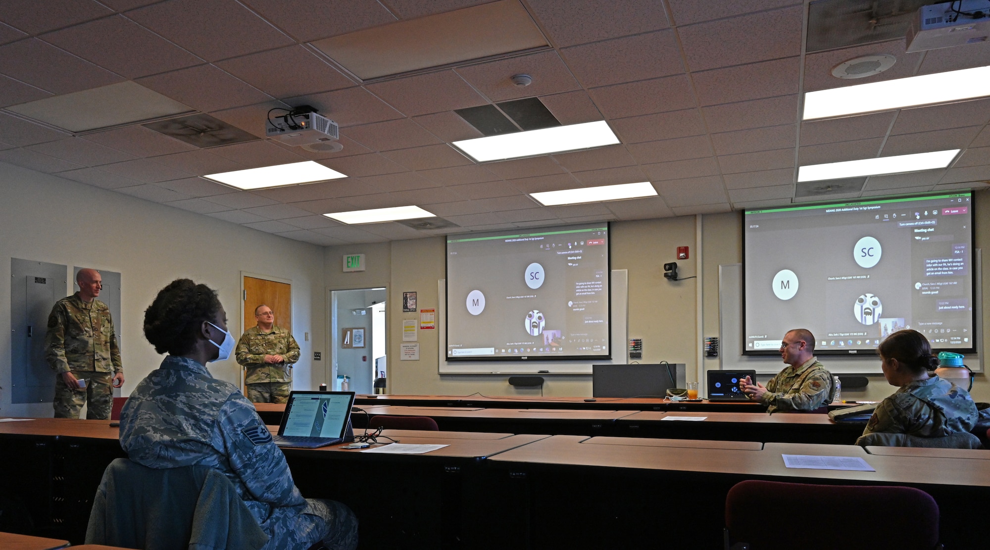 Chief Master Sgt. James Bottorff (left), 175th Mission Support Group superintendent and Chief Master Sgt. Thomas Myers, 175th Communications Squadron superintendent speak with Airmen during the 175th Wing's first additional duty first sergeant's symposium at Warfield Air National Guard Base at Martin State Airport, Middle River, Md., Dec. 2, 2020.