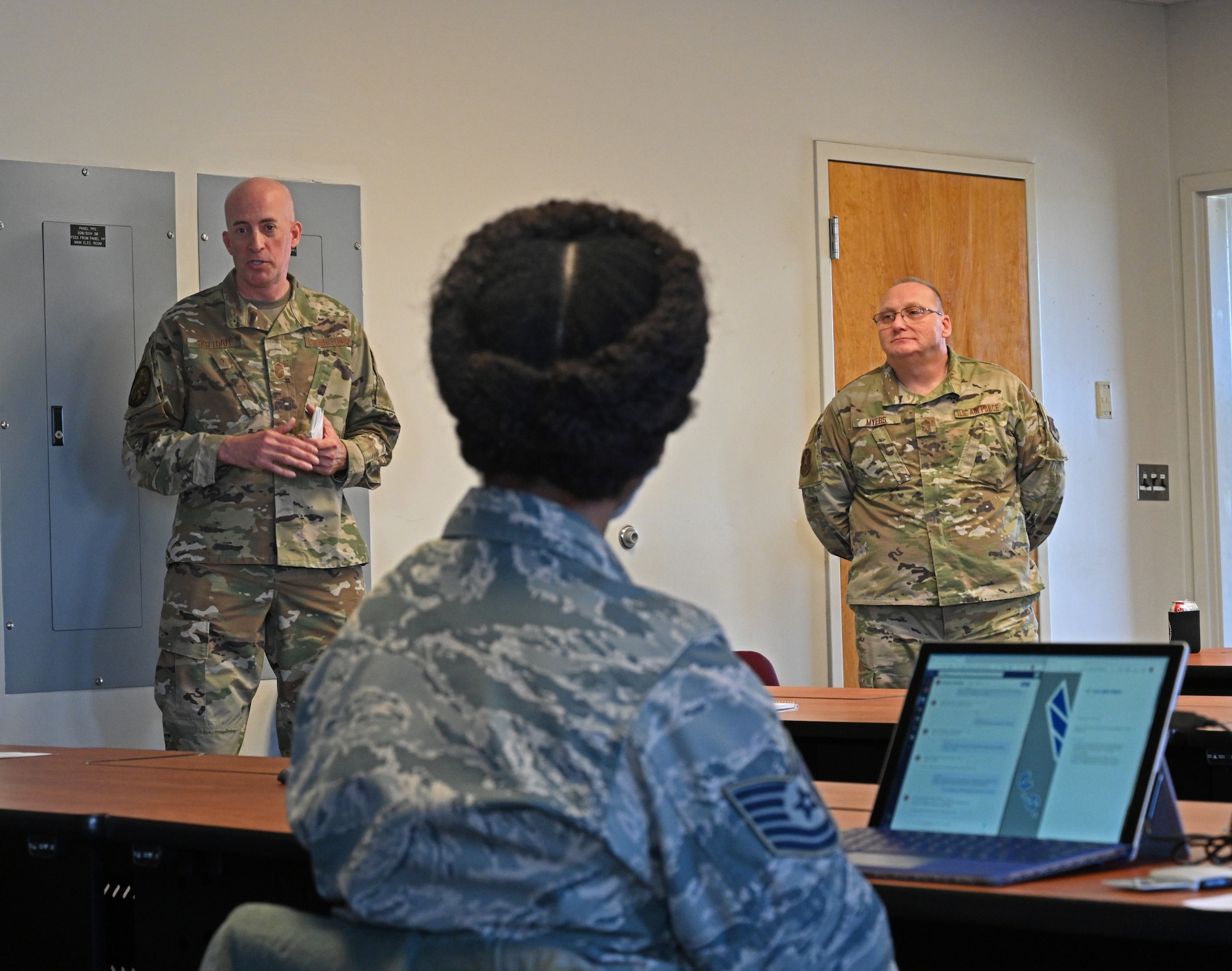 Chief Master Sgt. James Bottorff (left), 175th Mission Support Group superintendent and Chief Master Sgt. Thomas Myers, 175th Communications Squadron superintendent speak with Airmen during the 175th Wing's first additional duty first sergeant's symposium at Warfield Air National Guard Base at Martin State Airport, Middle River, Md., Dec. 2, 2020.